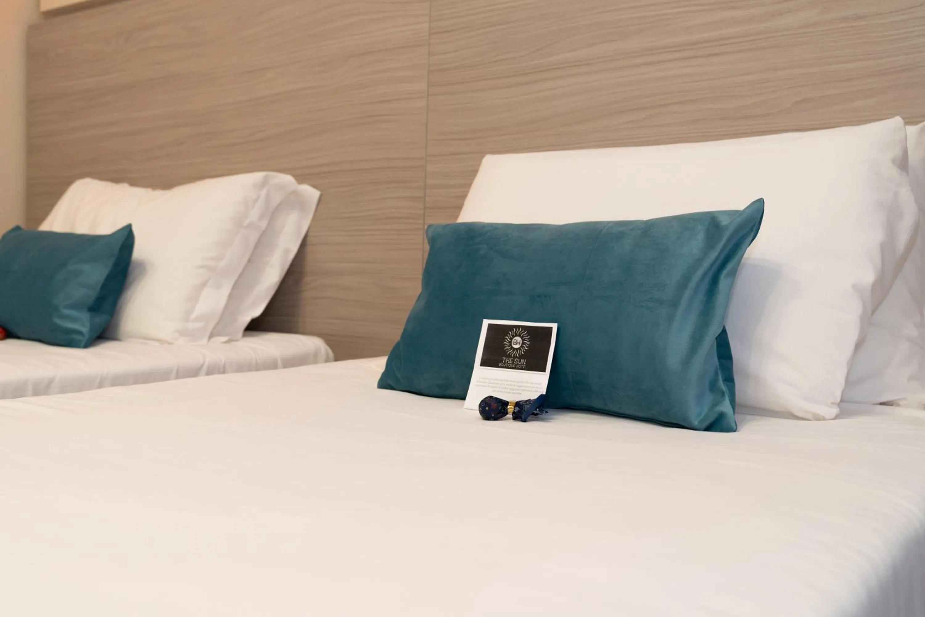 Bed in THE SUN HOTEL BOUTIQUE NAPOLI