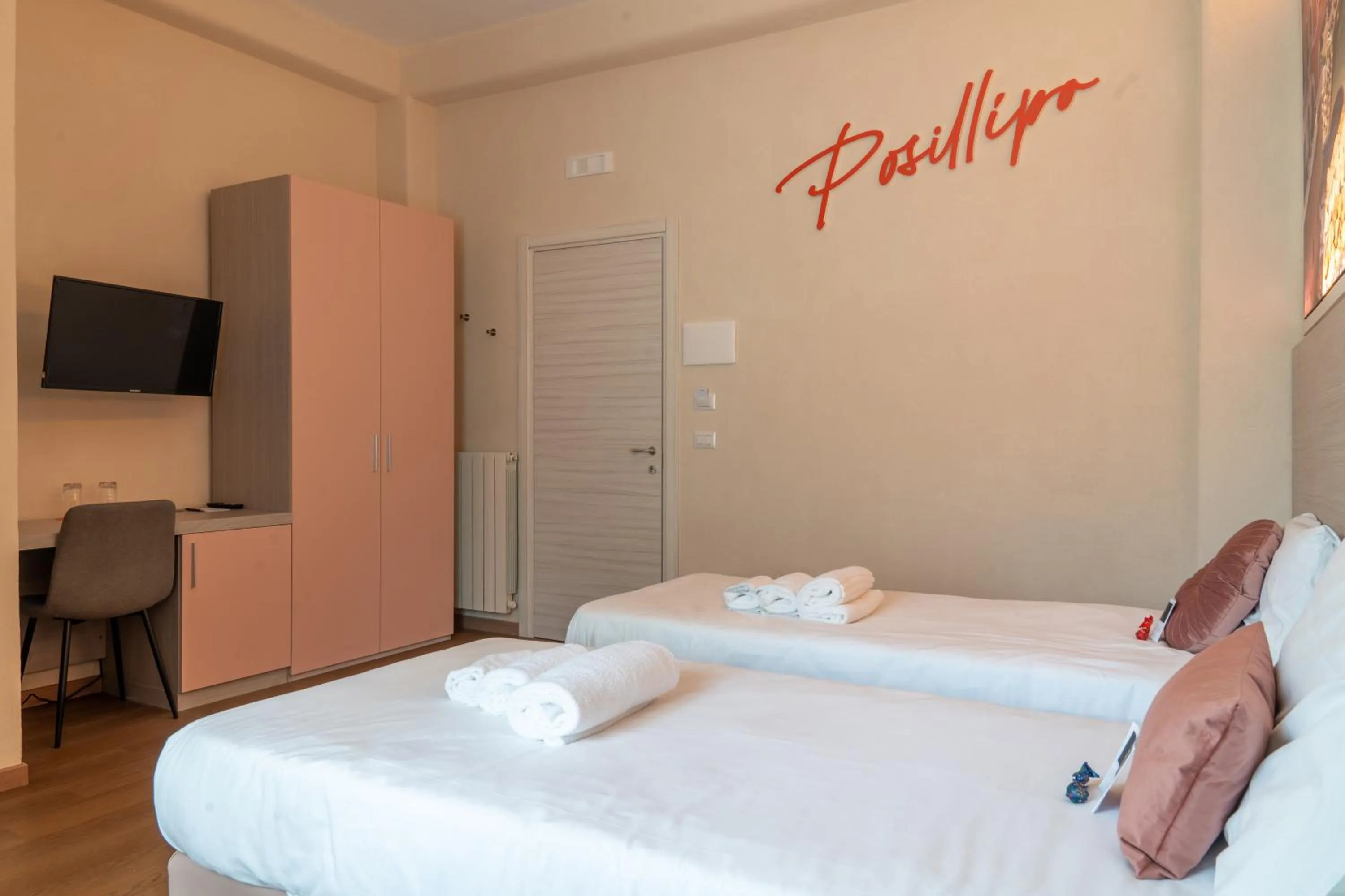 Bed in THE SUN HOTEL BOUTIQUE NAPOLI