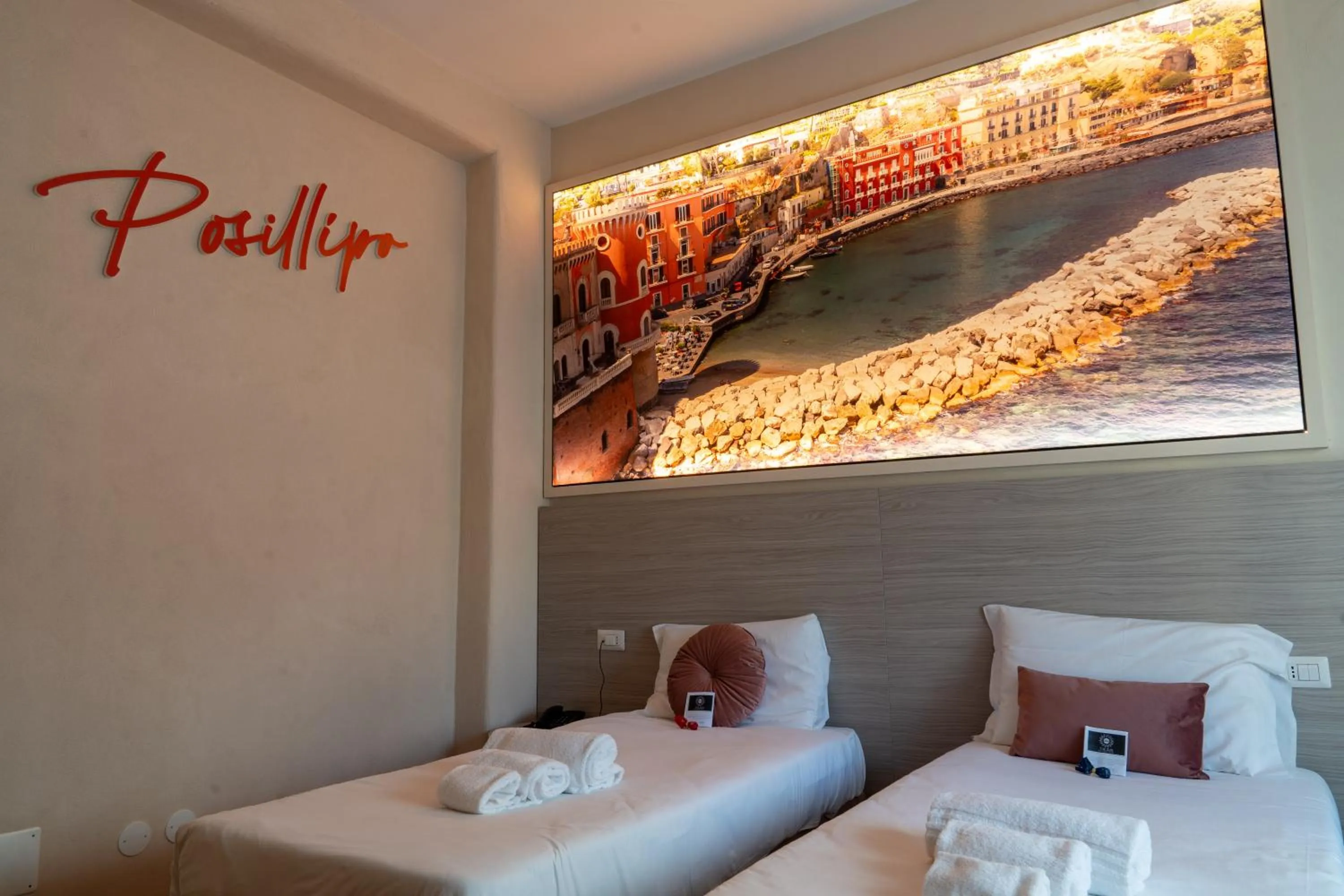 Bed in THE SUN HOTEL BOUTIQUE NAPOLI