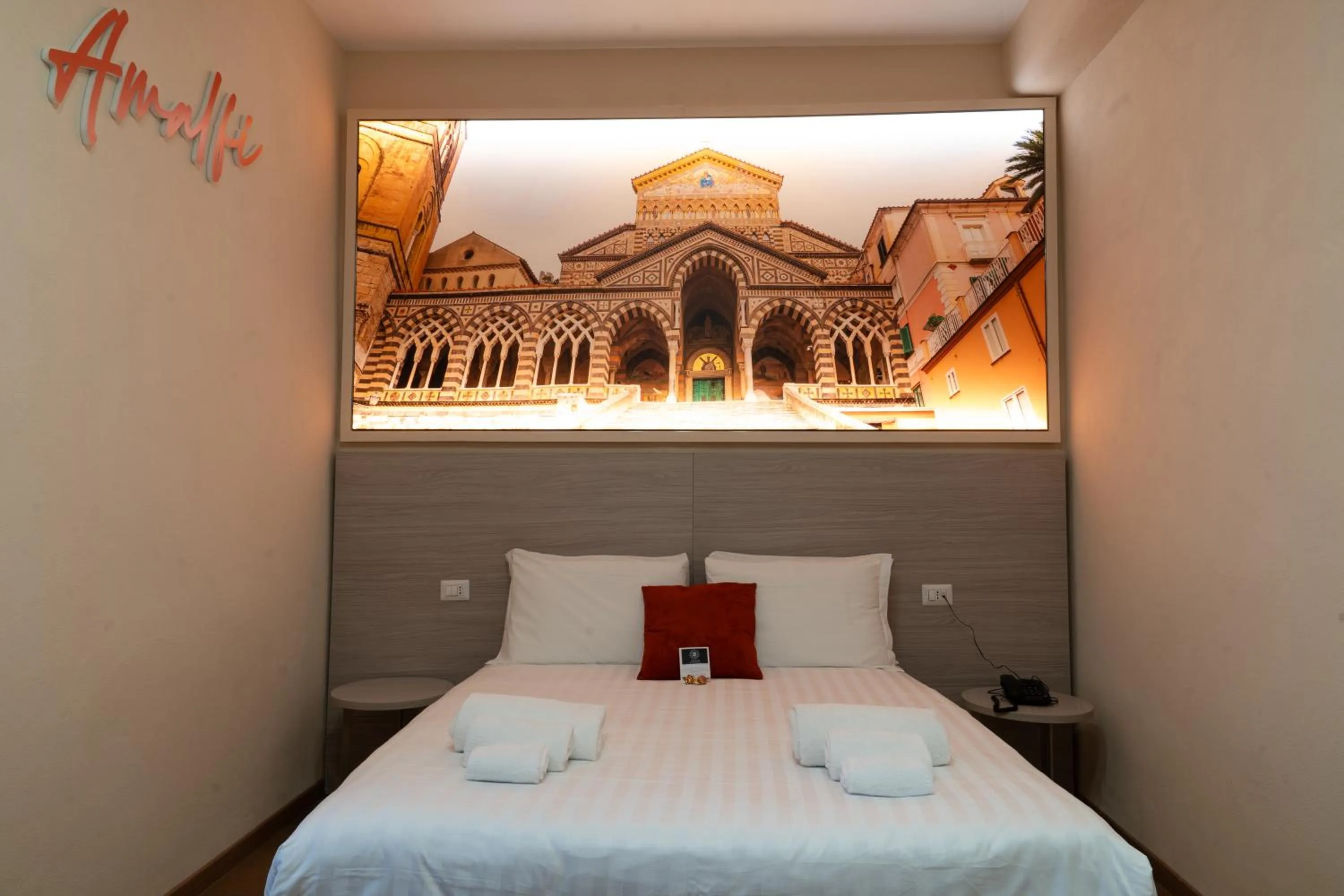 Bed in THE SUN HOTEL BOUTIQUE NAPOLI