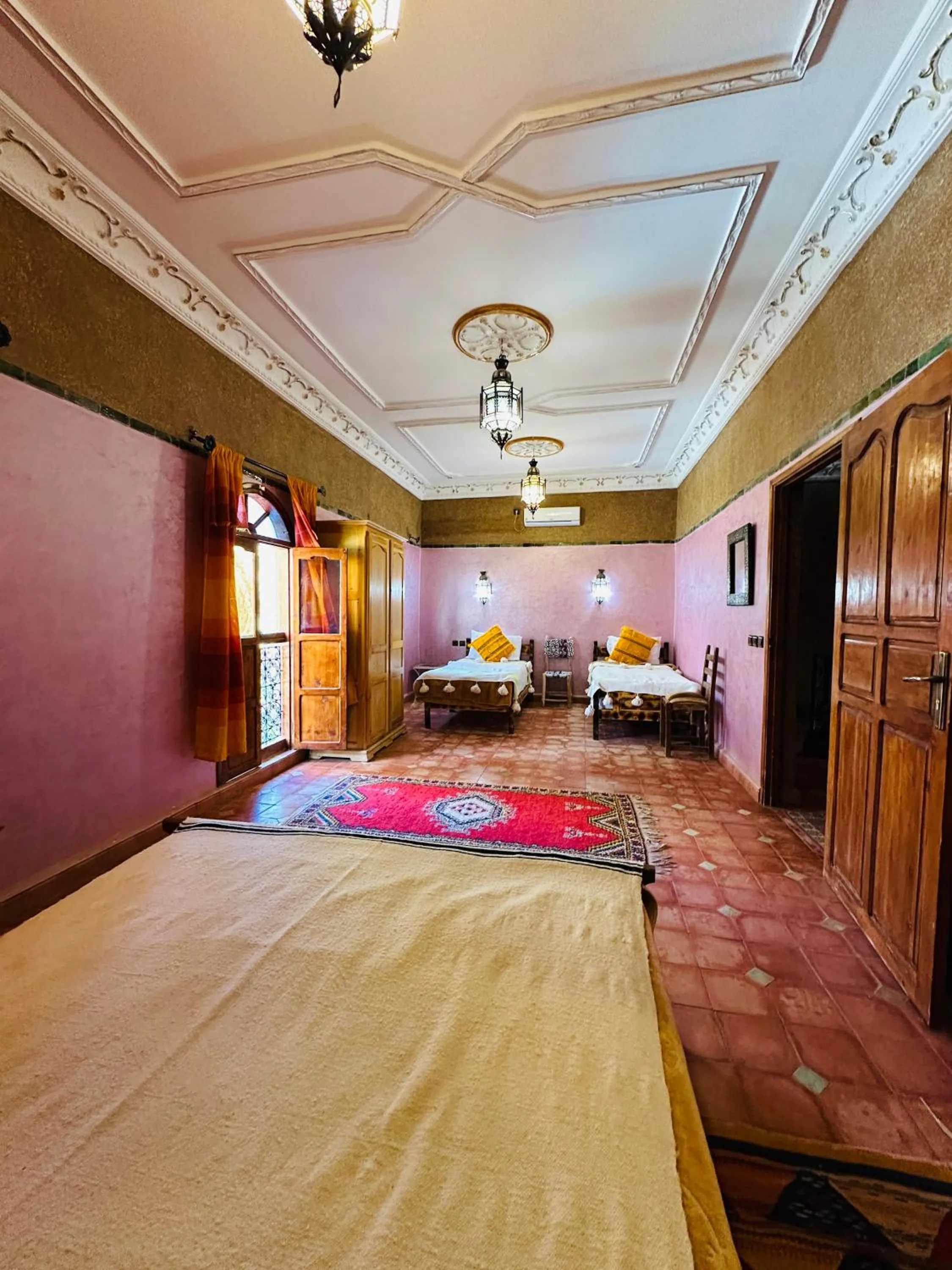 Bed in Riad Soleil du Monde