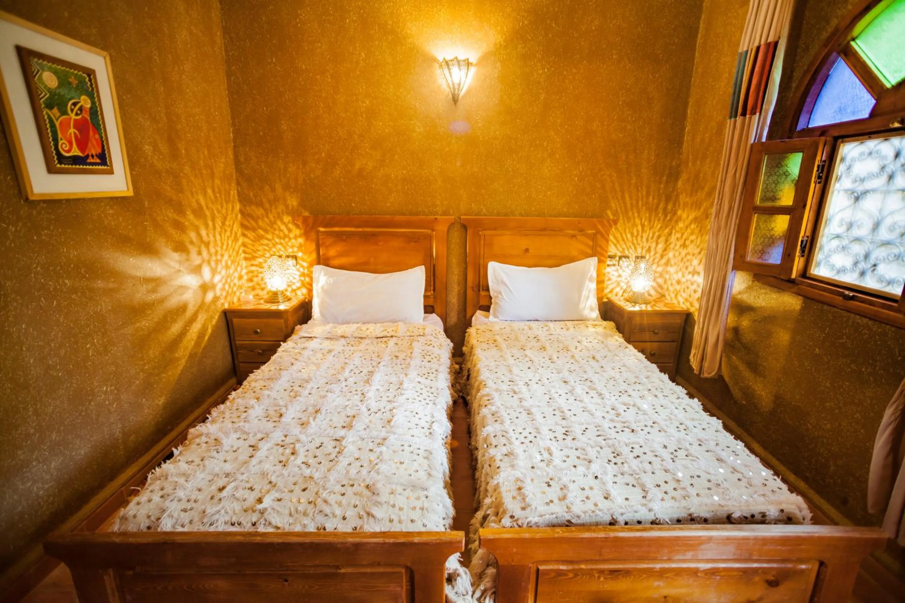 Bed in Riad Soleil du Monde