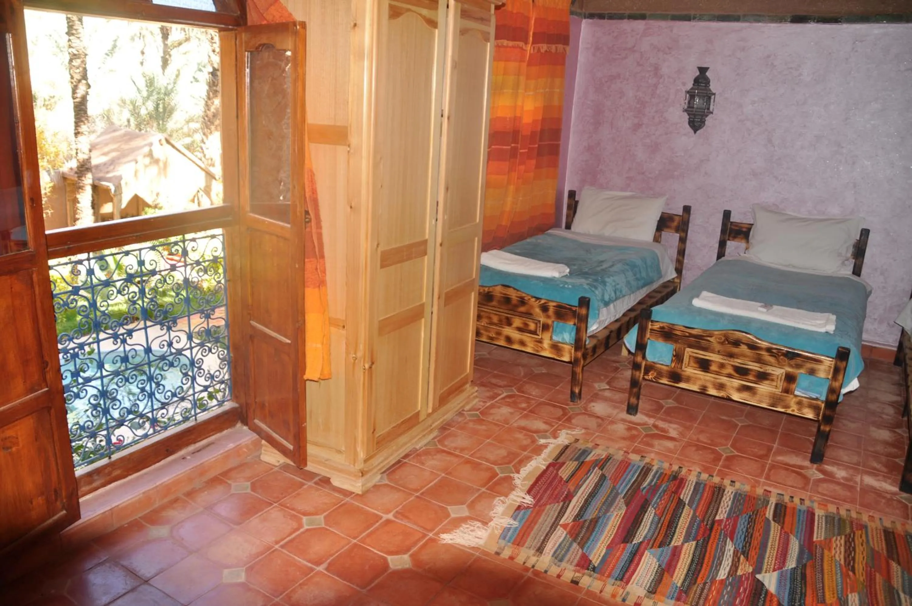 Bed in Riad Soleil du Monde