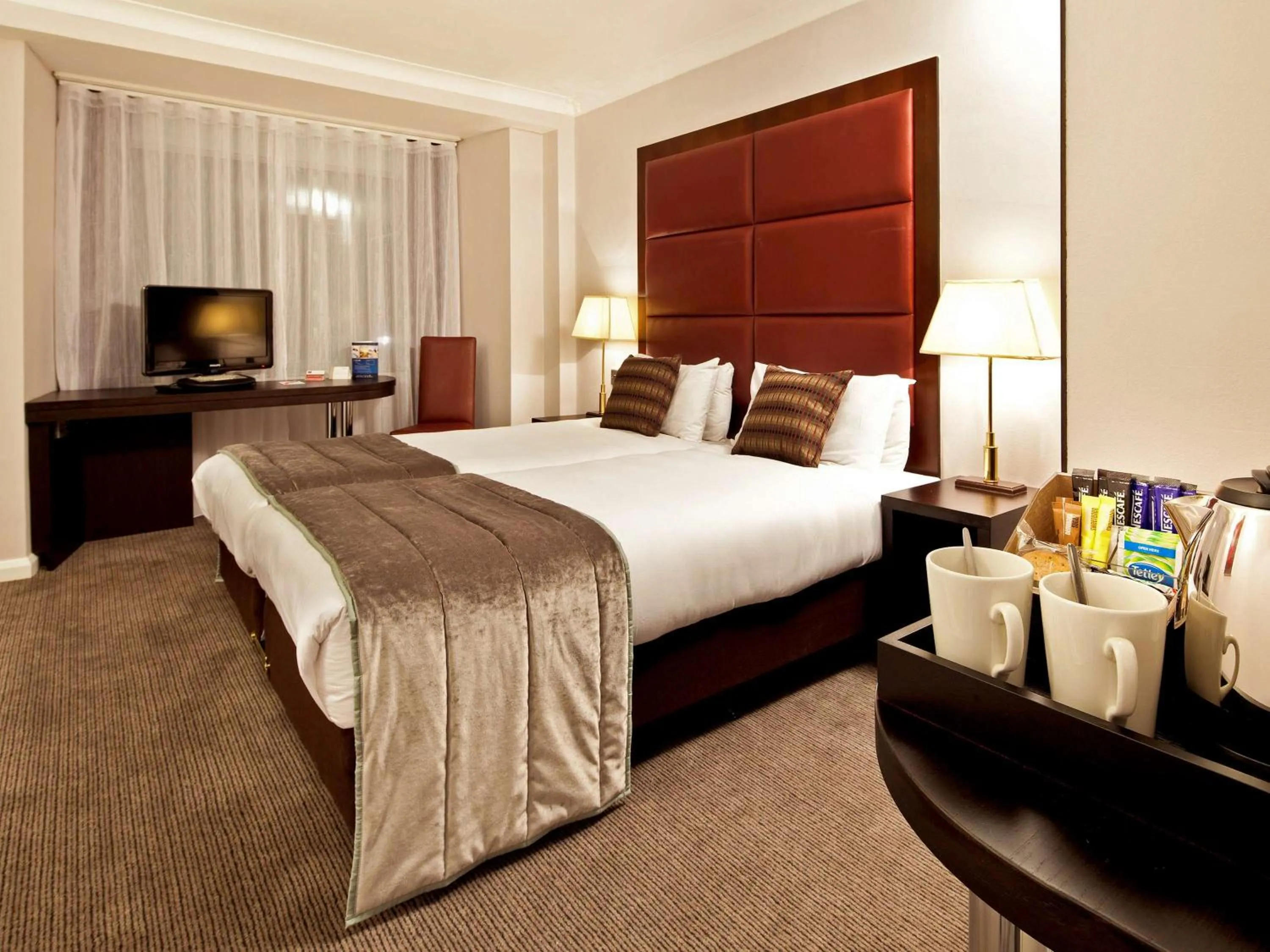 Photo of the whole room in Mercure London Kensington Hotel