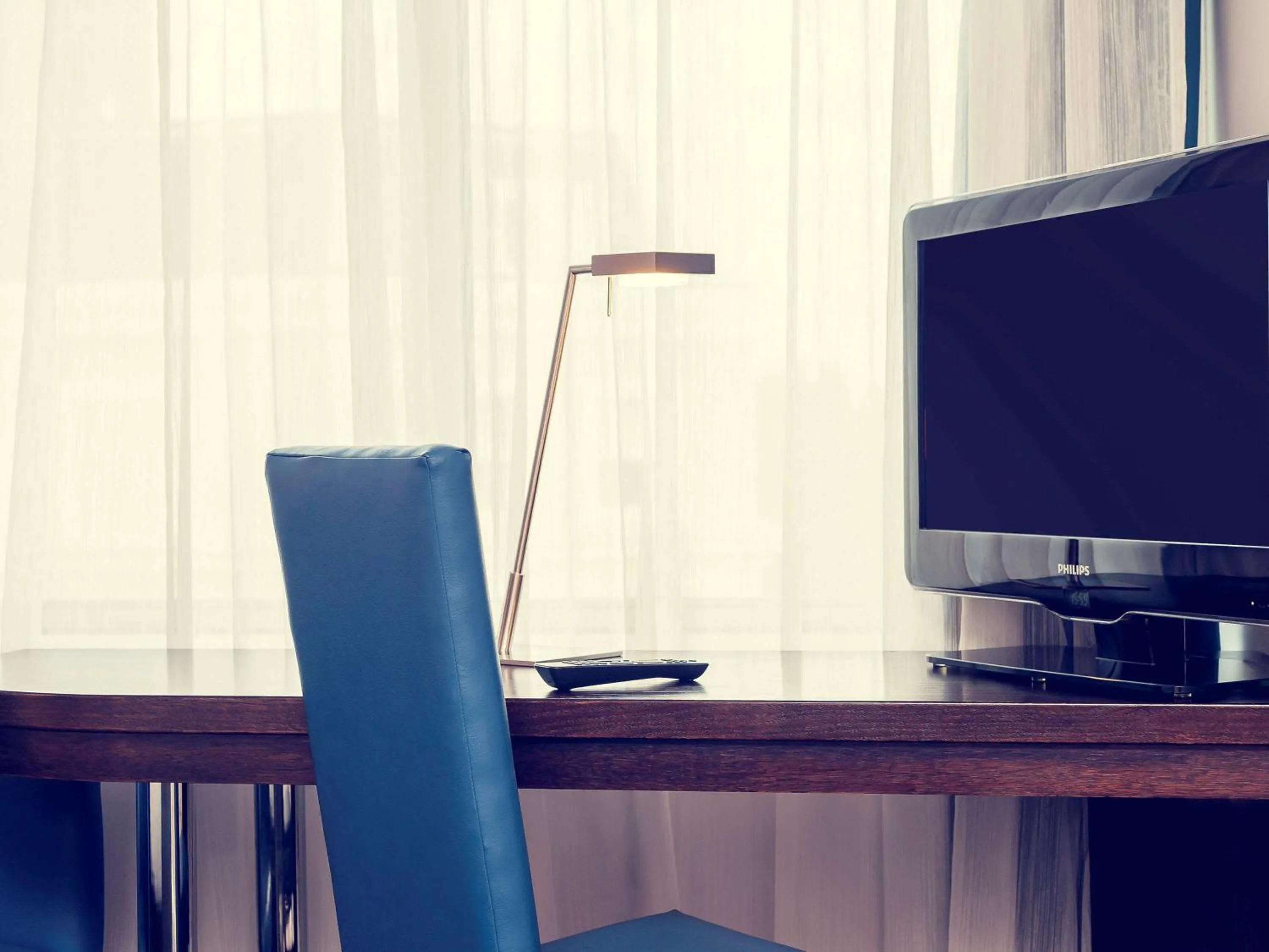 Photo of the whole room, TV/Entertainment Center in Mercure London Kensington Hotel