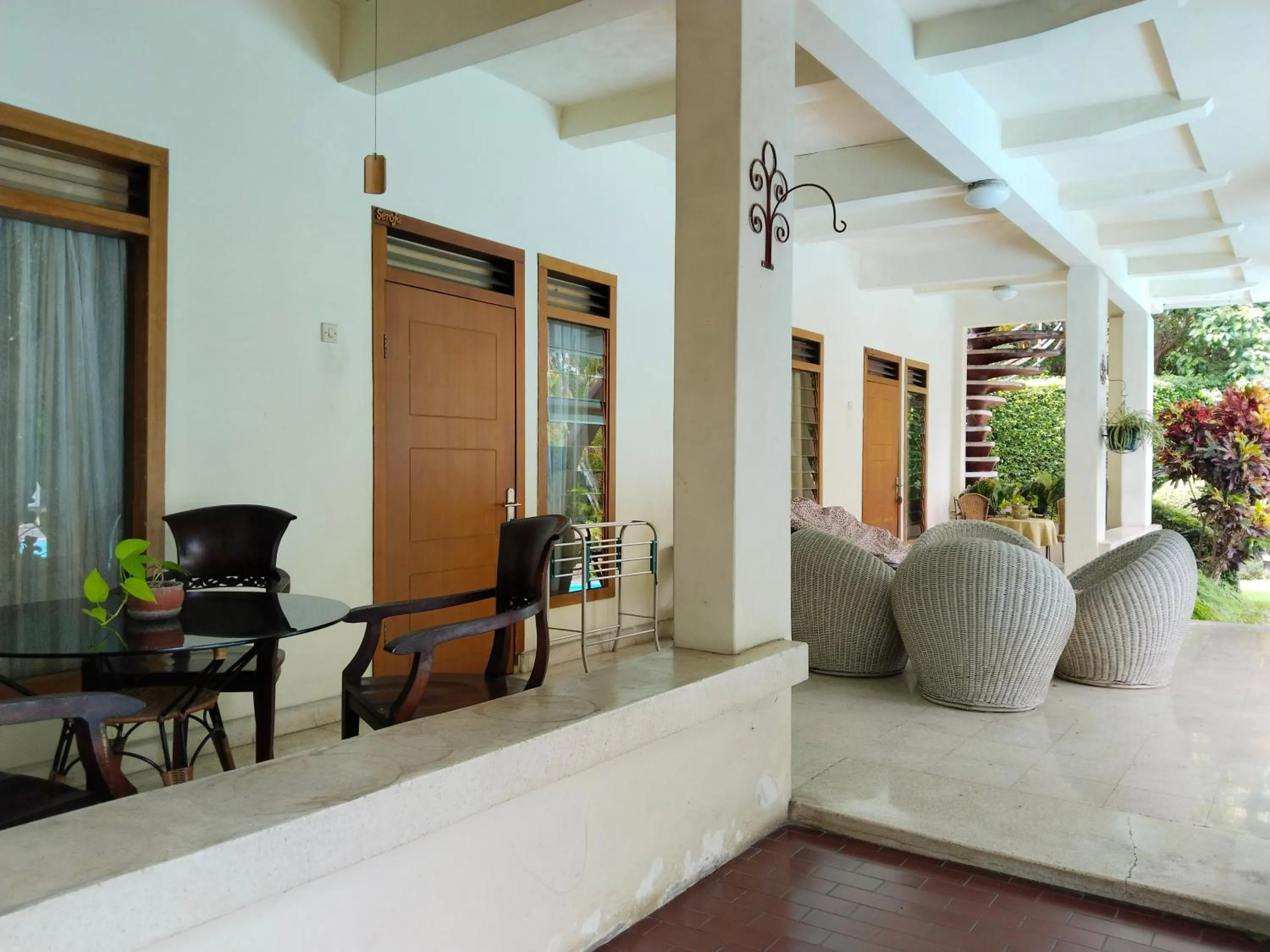 Seating area in The Garden Family Guest House powered by Cocotel