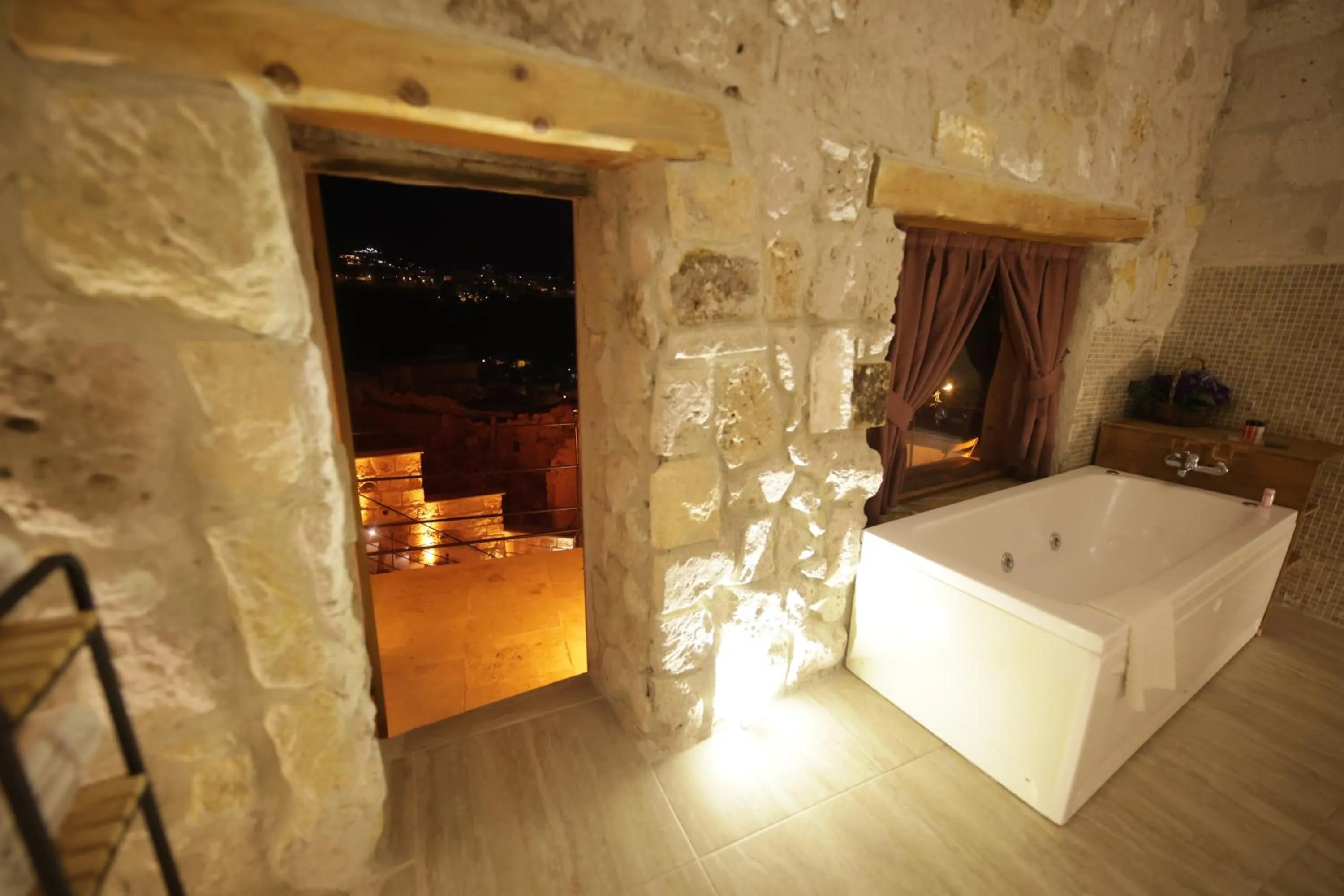 Bathroom, Bed in My Cave Suites