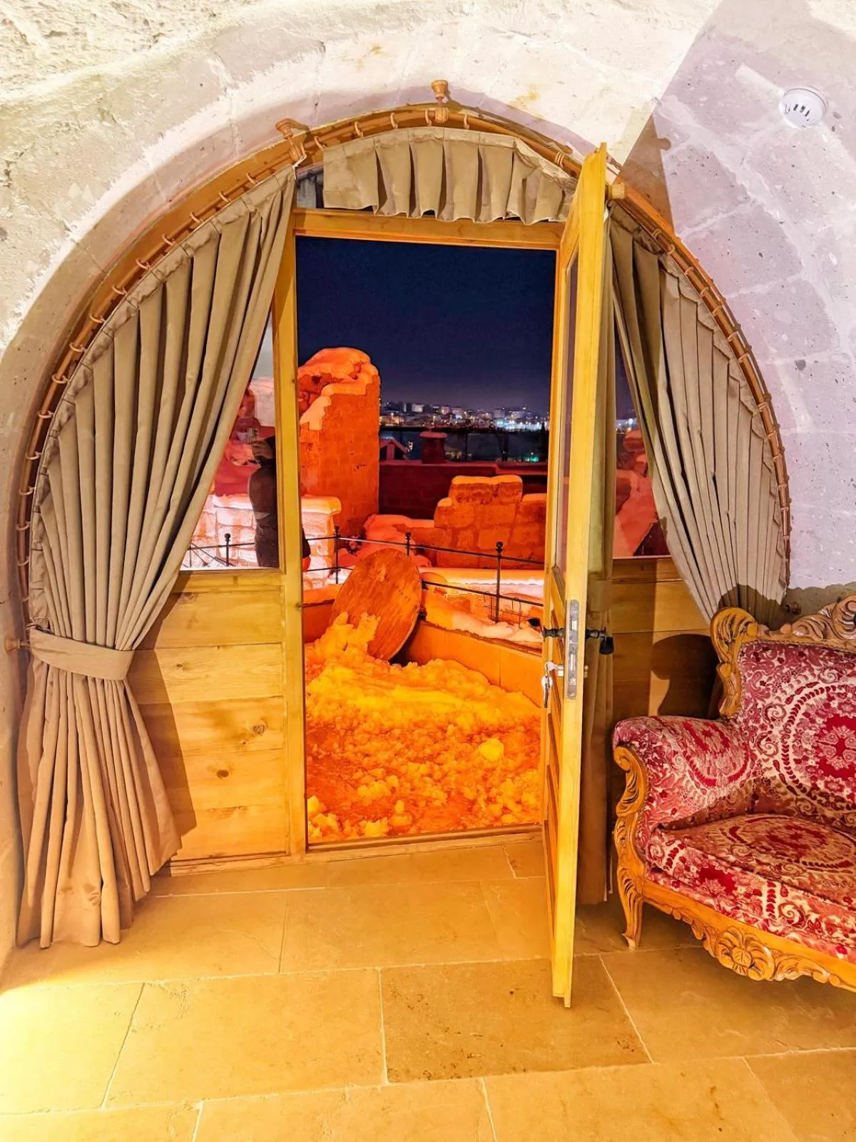 Seating area, Bed in My Cave Suites