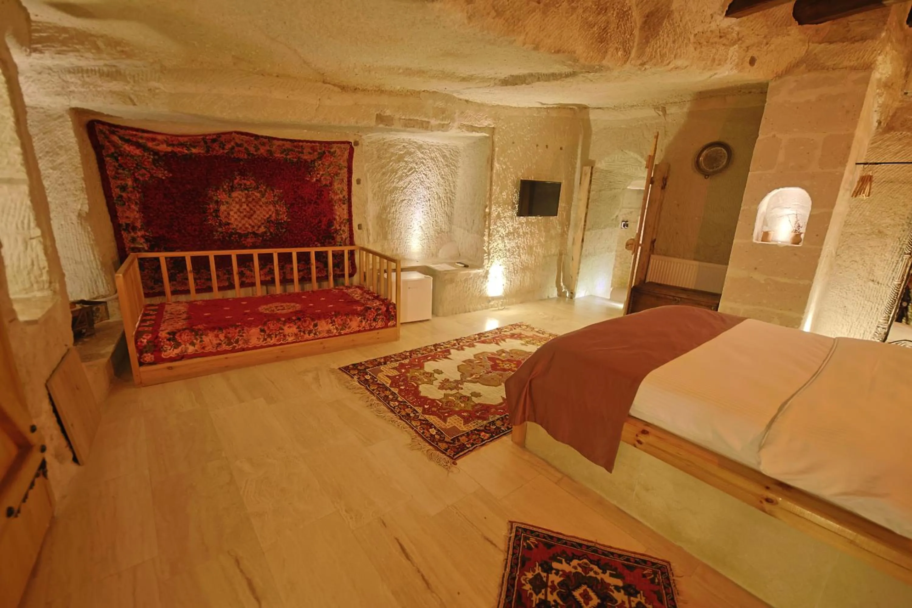 Living room, Bed in My Cave Suites