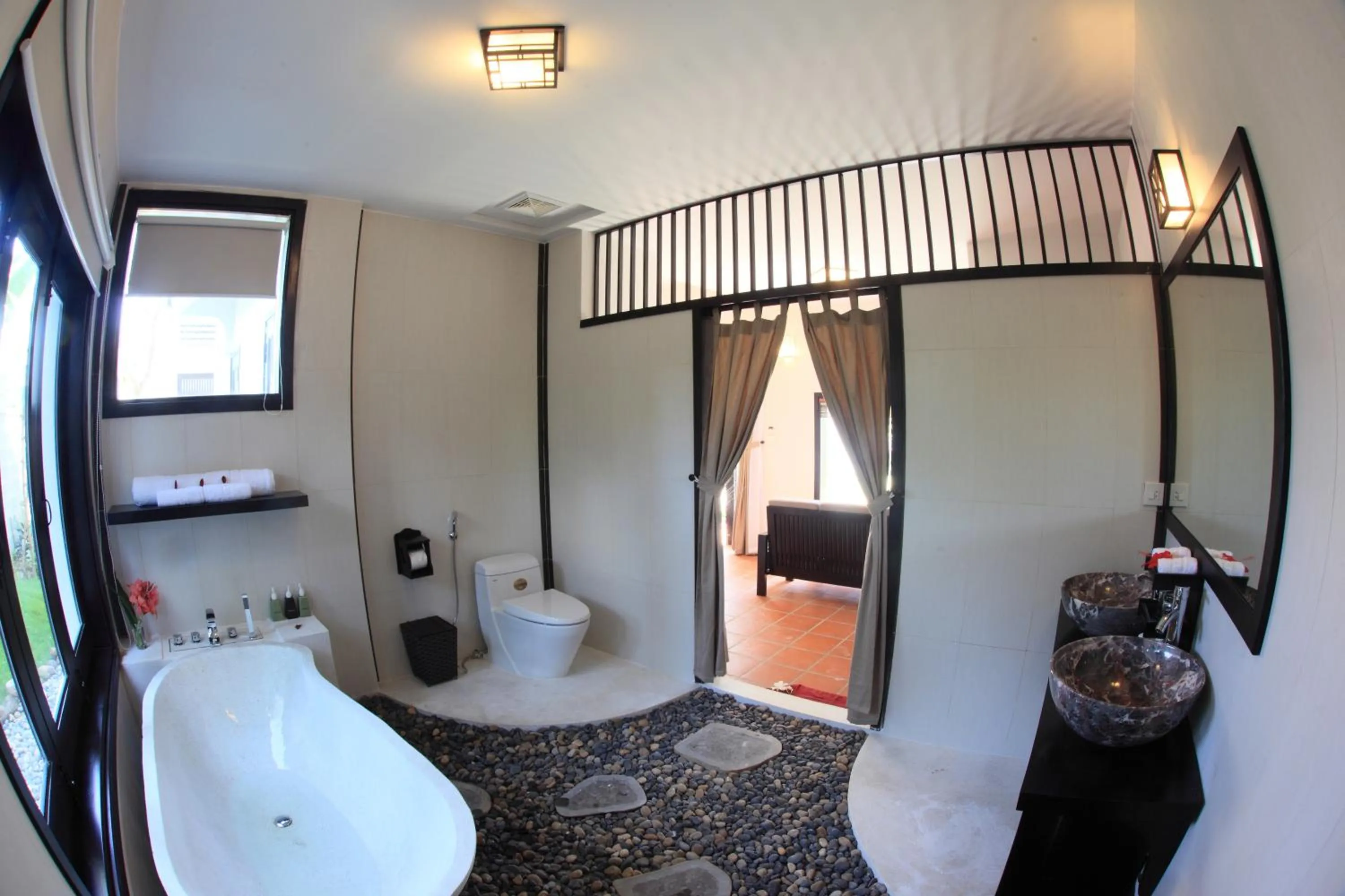 Bathroom, Bed in East West Villa