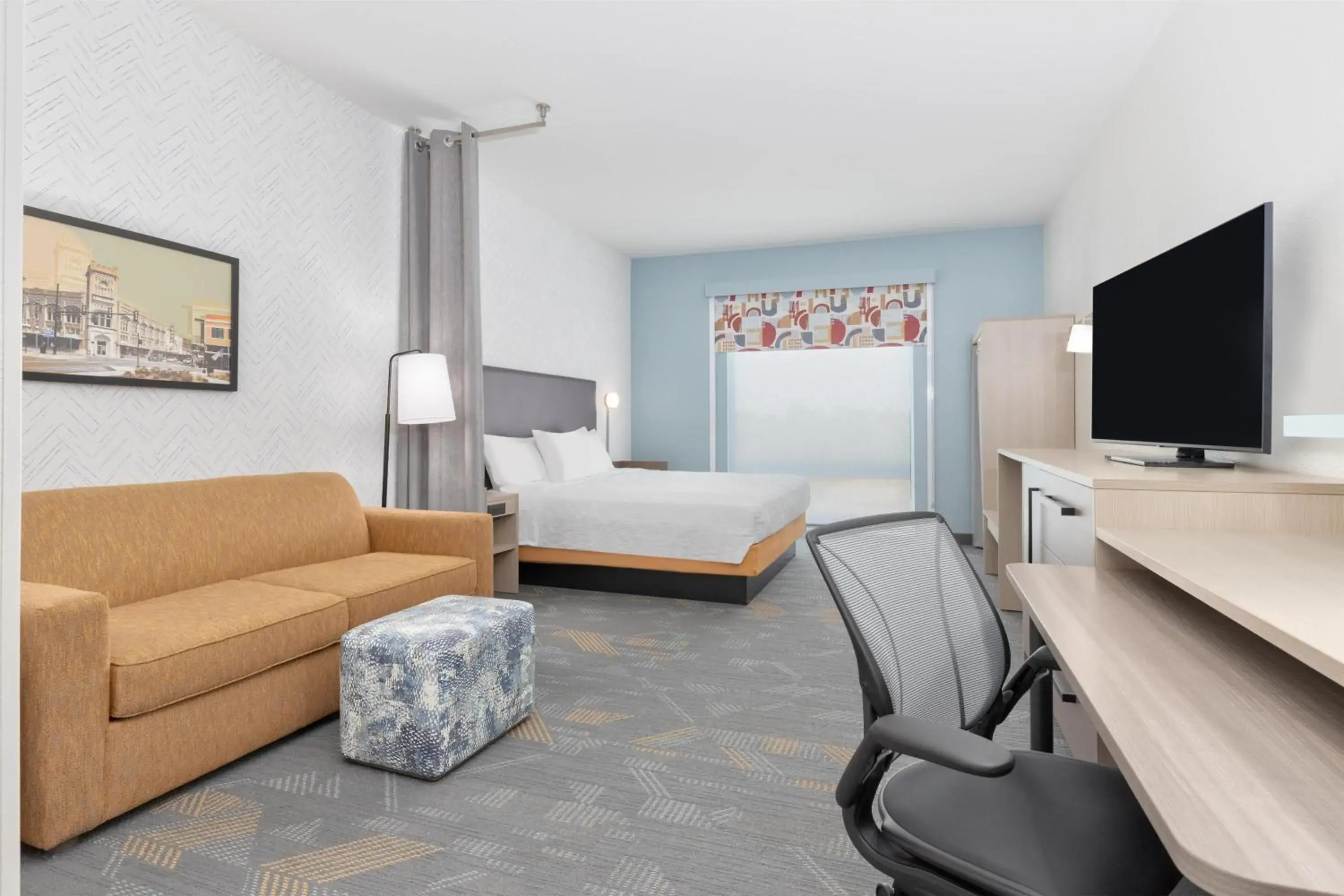 Living room in Home2 Suites By Hilton Paris Living room in Home2 Suites By Hilton Paris