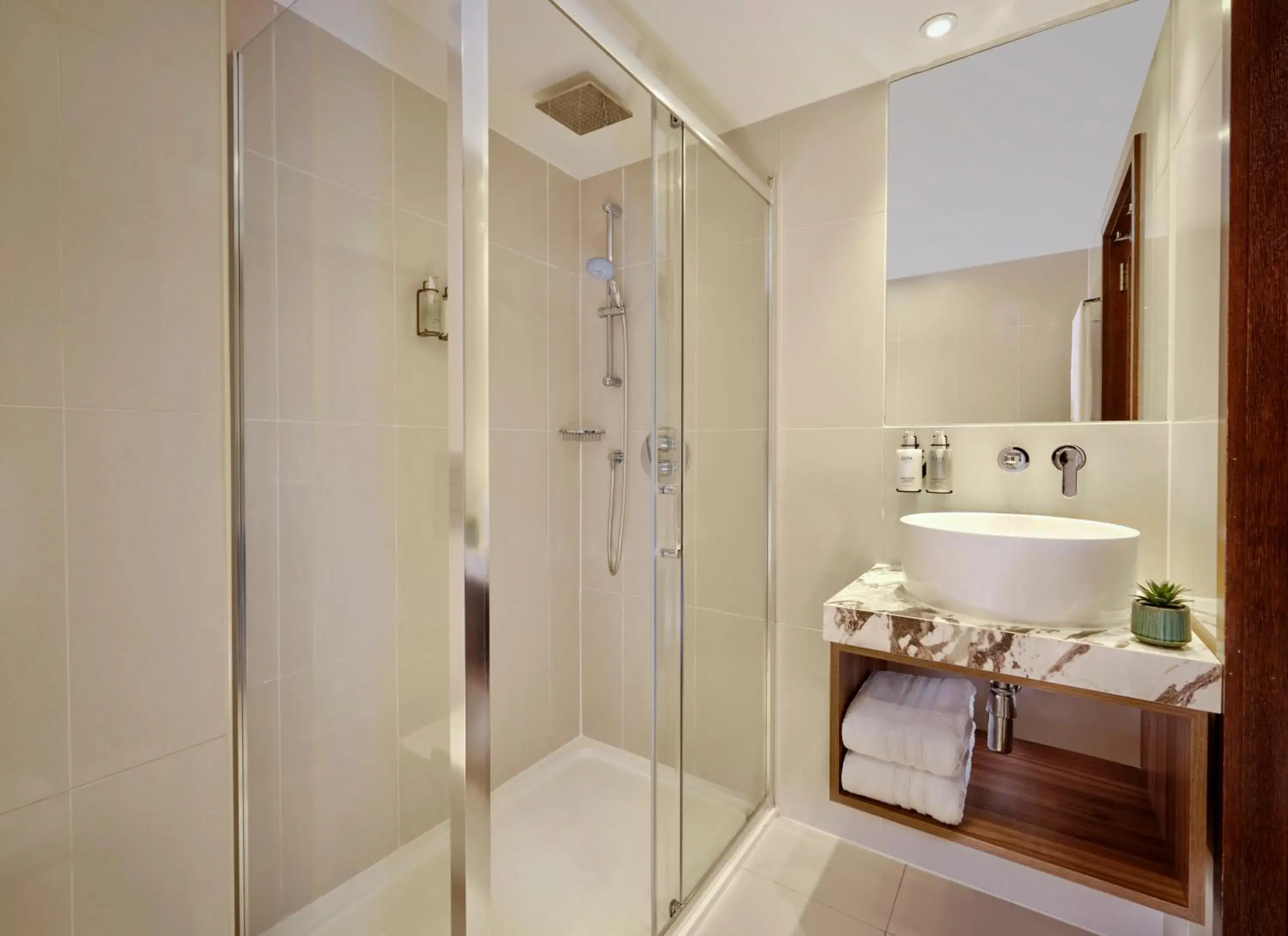 Bathroom in The Cura Hotel Kensington, London, a Tribute Portfolio Hotel Bathroom in The Cura Hotel Kensington, London, a Tribute Portfolio Hotel