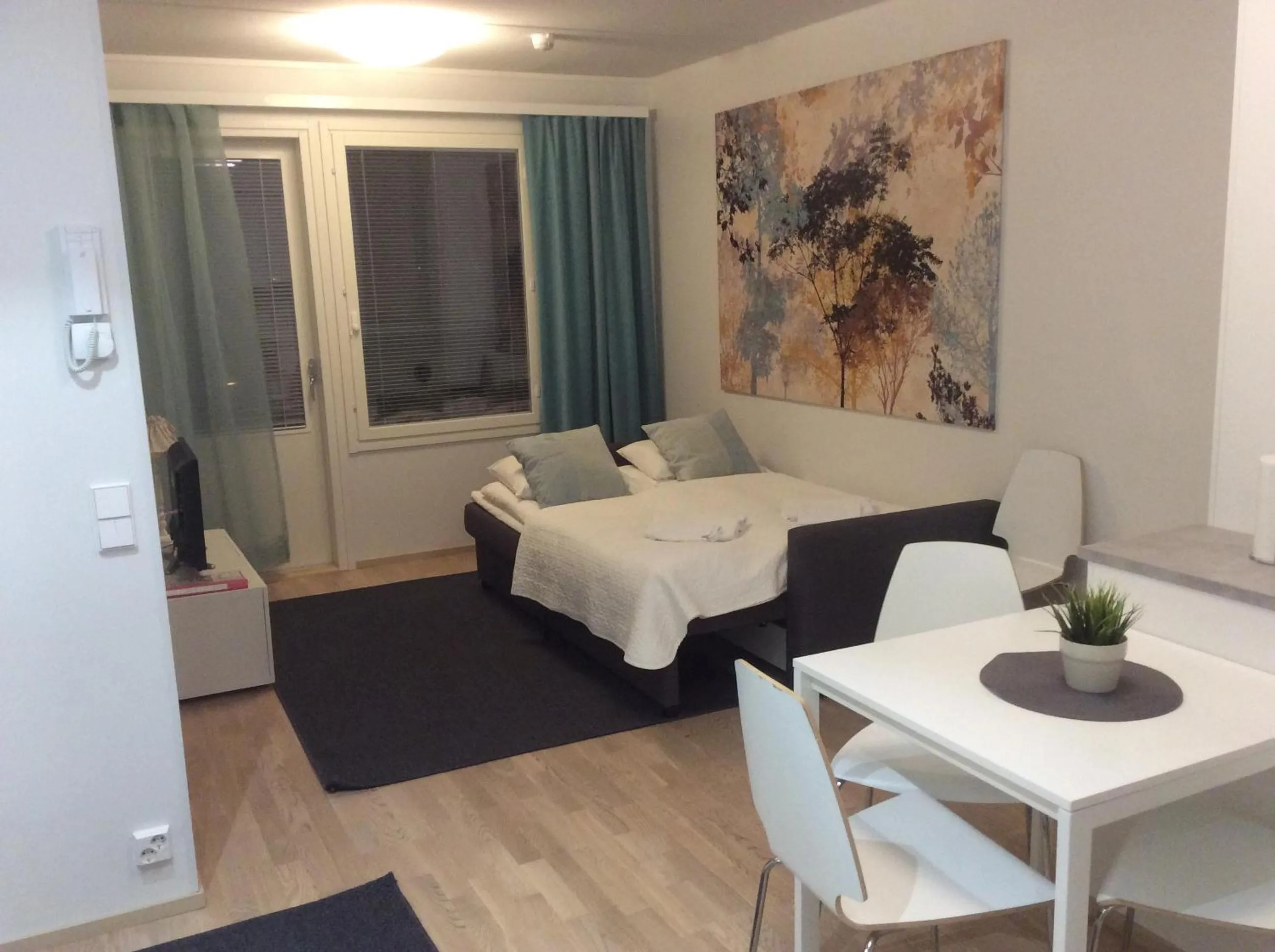 Bed in Kotimaailma Apartments Rovaniemi