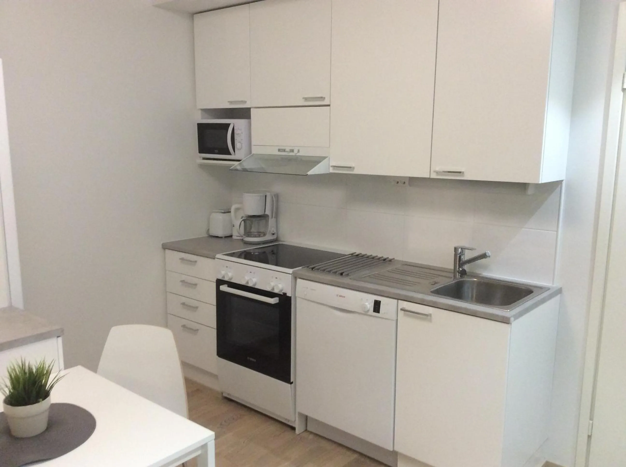 Kitchen or kitchenette in Kotimaailma Apartments Rovaniemi
