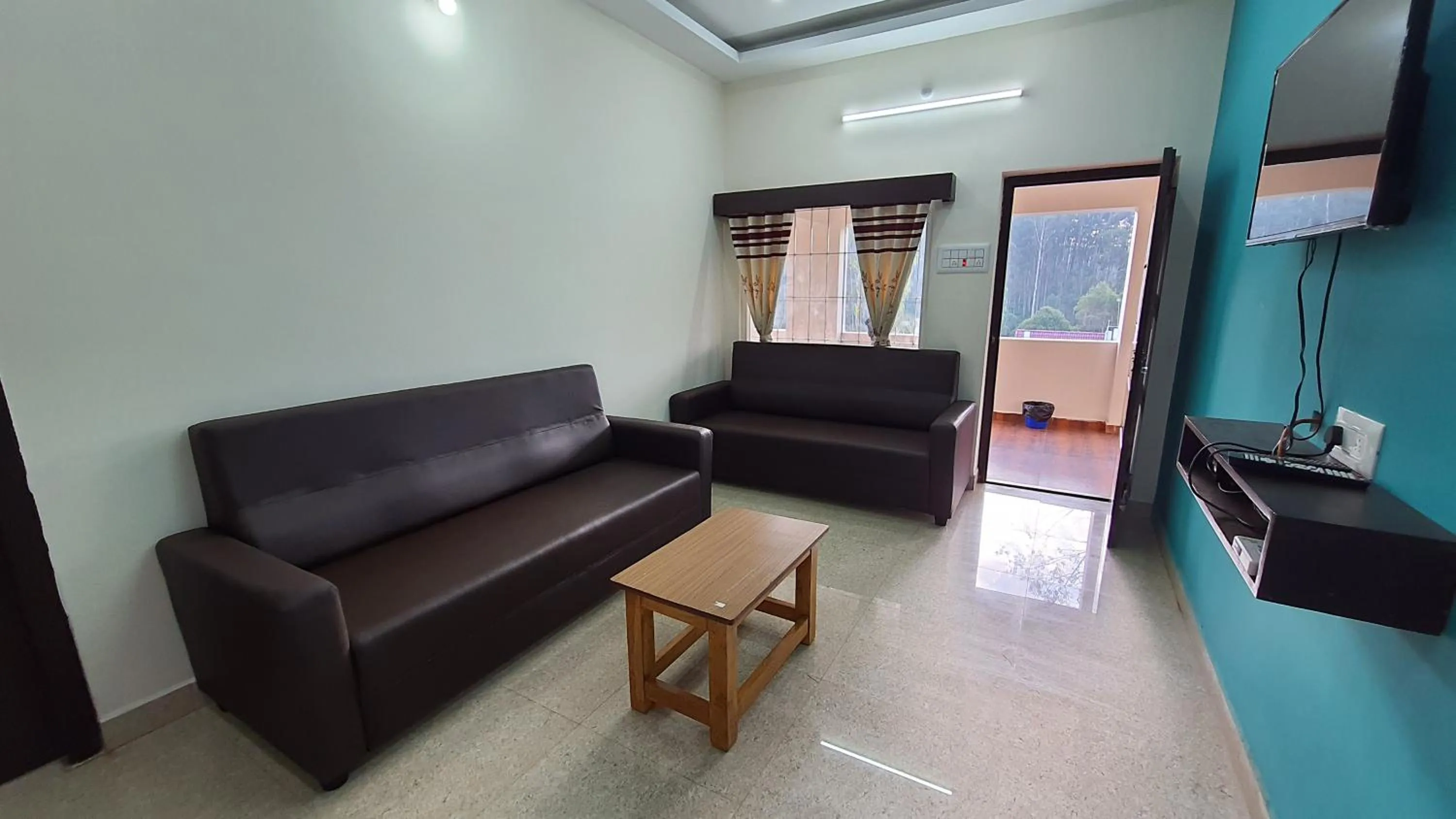 Communal lounge/ TV room in Grandwood Coco Resort Yercaud