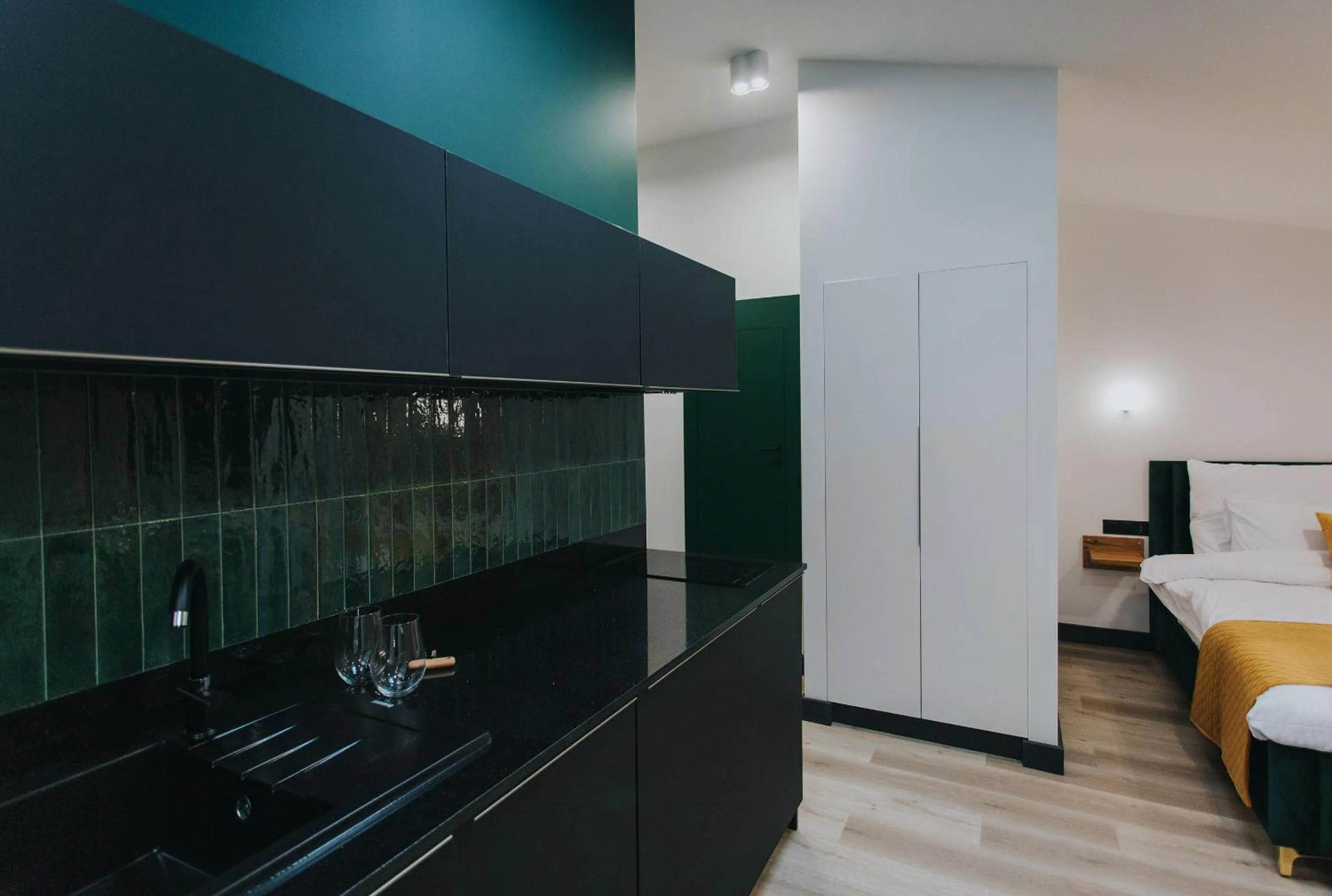 Kitchen or kitchenette, Bed in Apartamenty BIBLIO