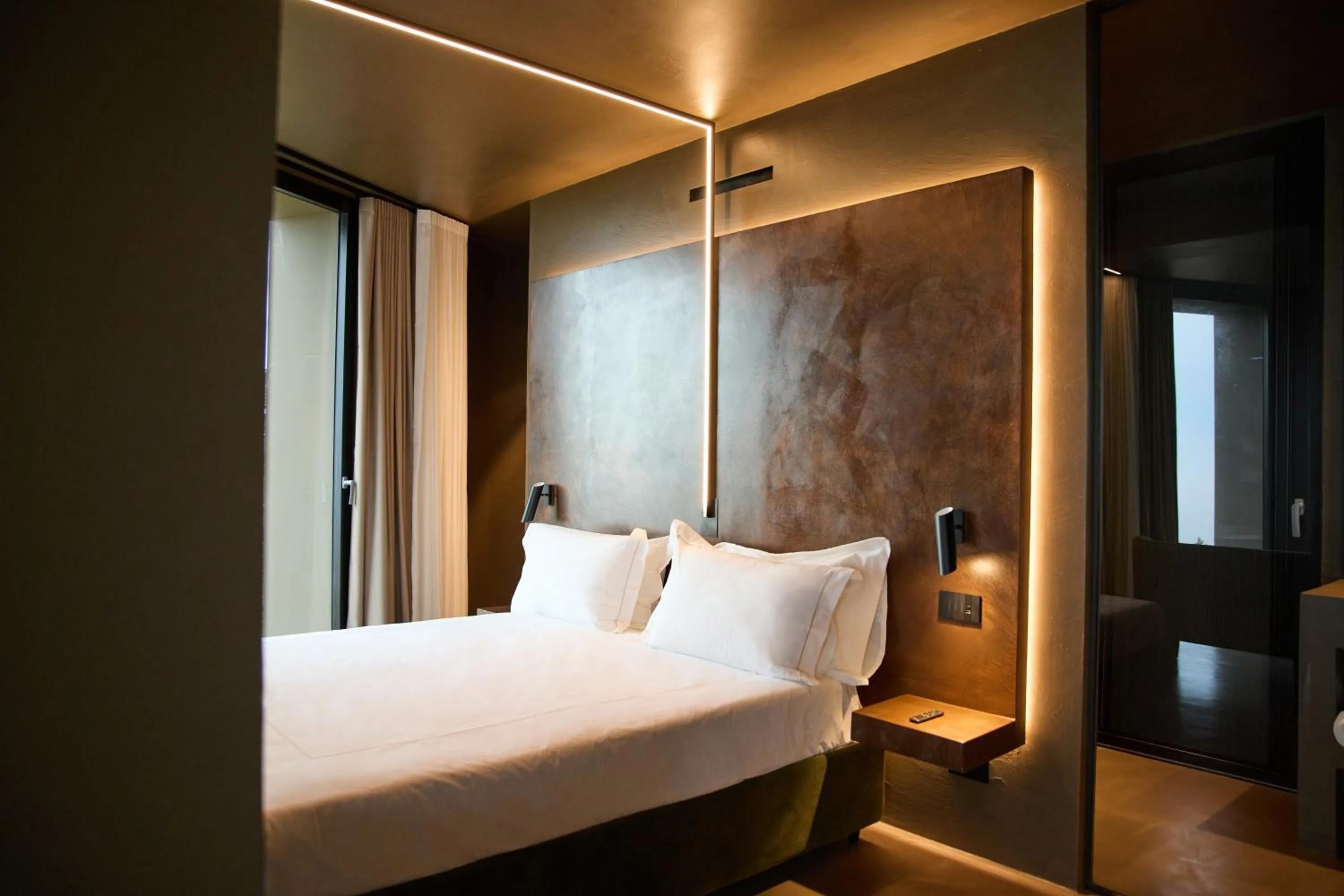 Bed in Le Agavi Resort & SPA