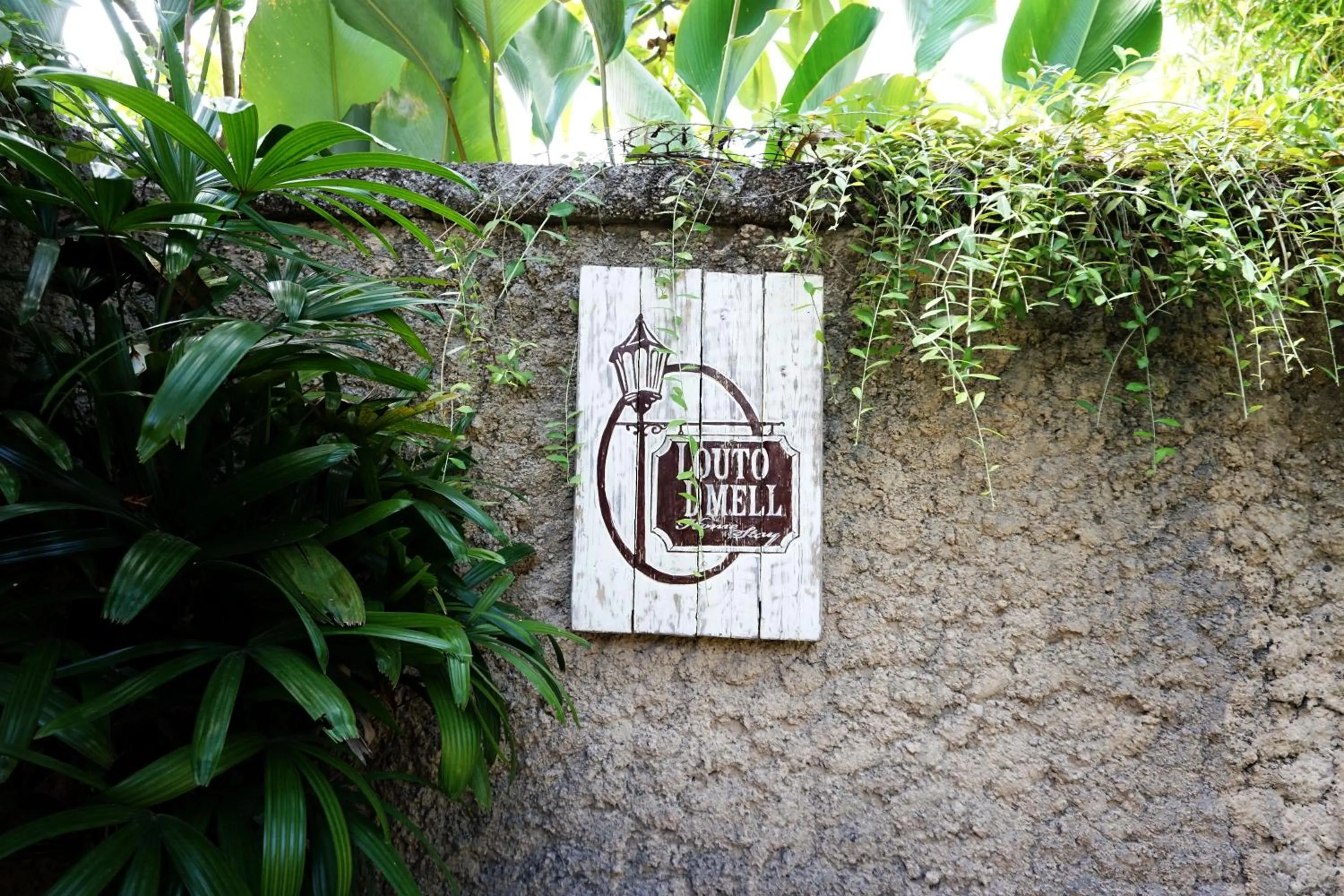 Property logo or sign in Louto Dmell Villa & Guesthouse