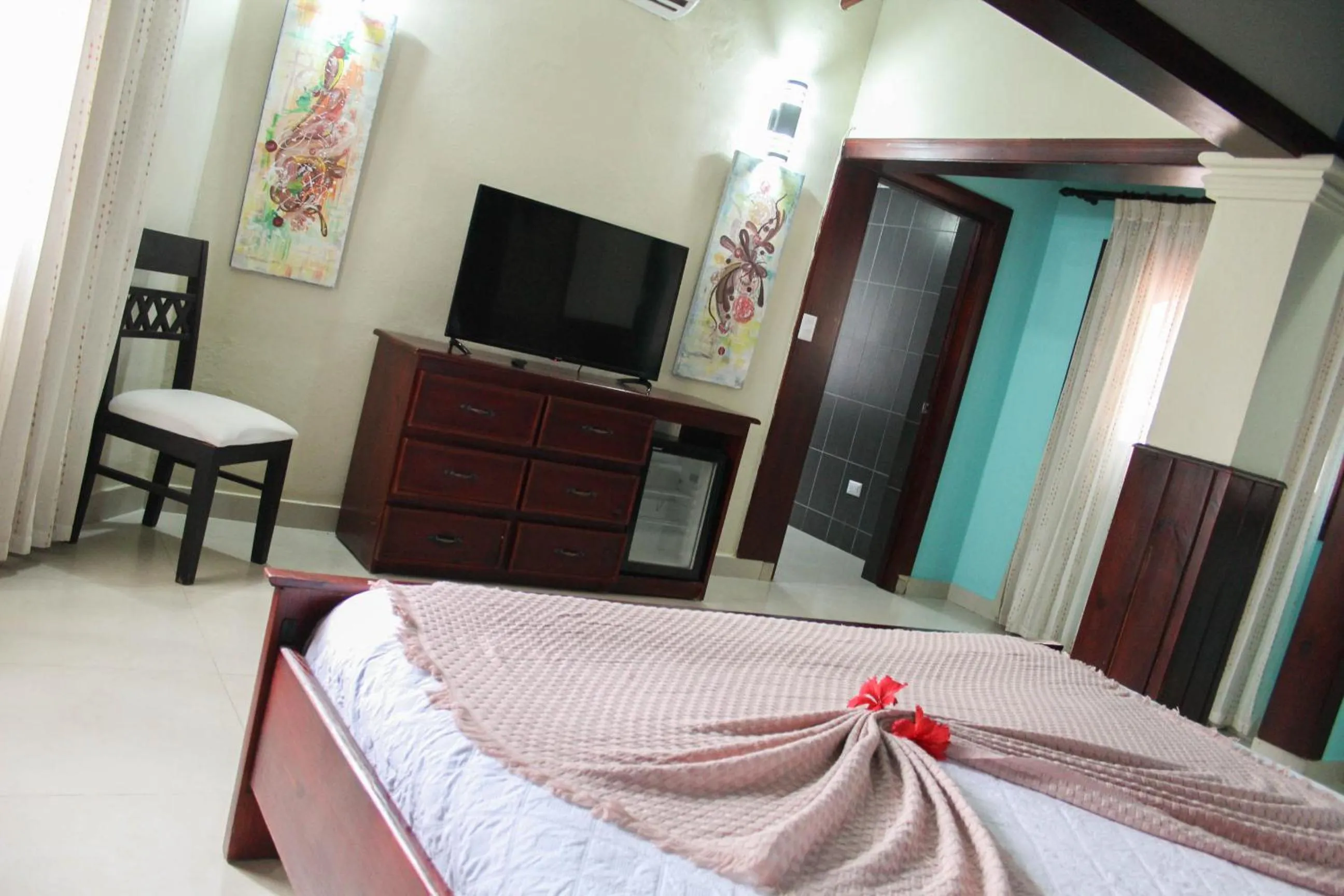 Communal lounge/ TV room, Bed in Hotel Plaza Brisas