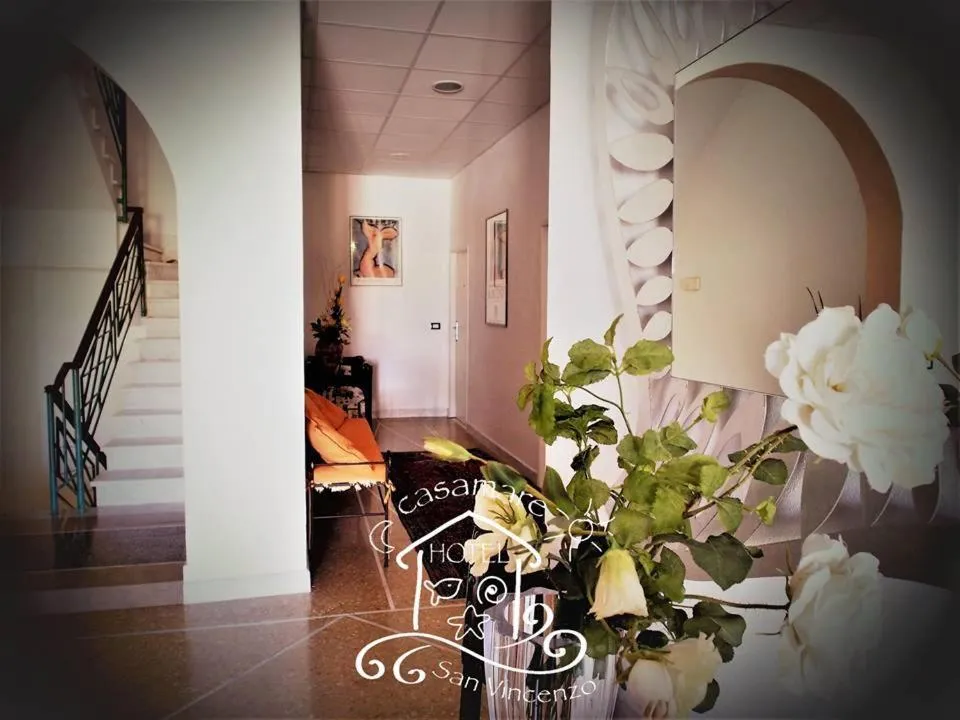 Communal lounge/ TV room in Casamare Hotel