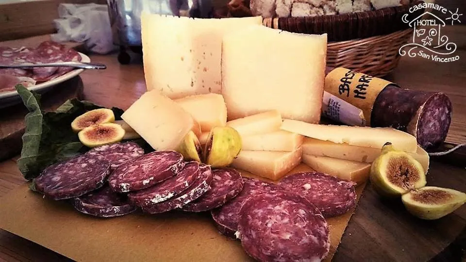 Communal lounge/ TV room in Casamare Hotel