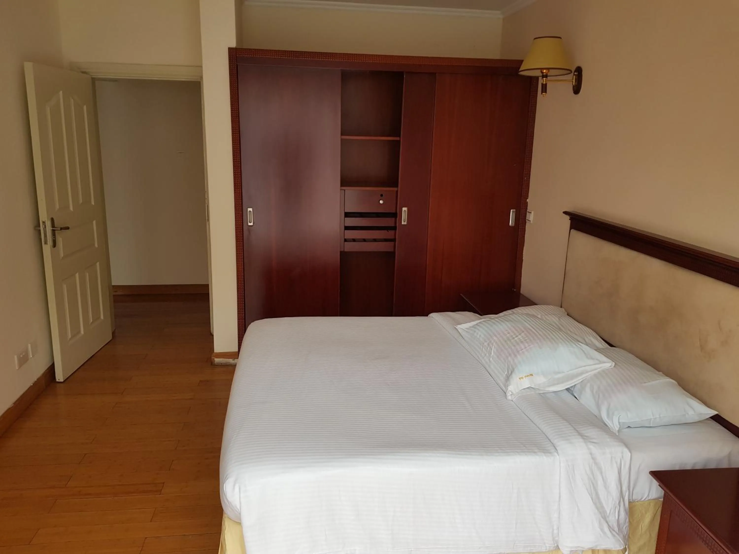 Bed in Natural Oak Apartments