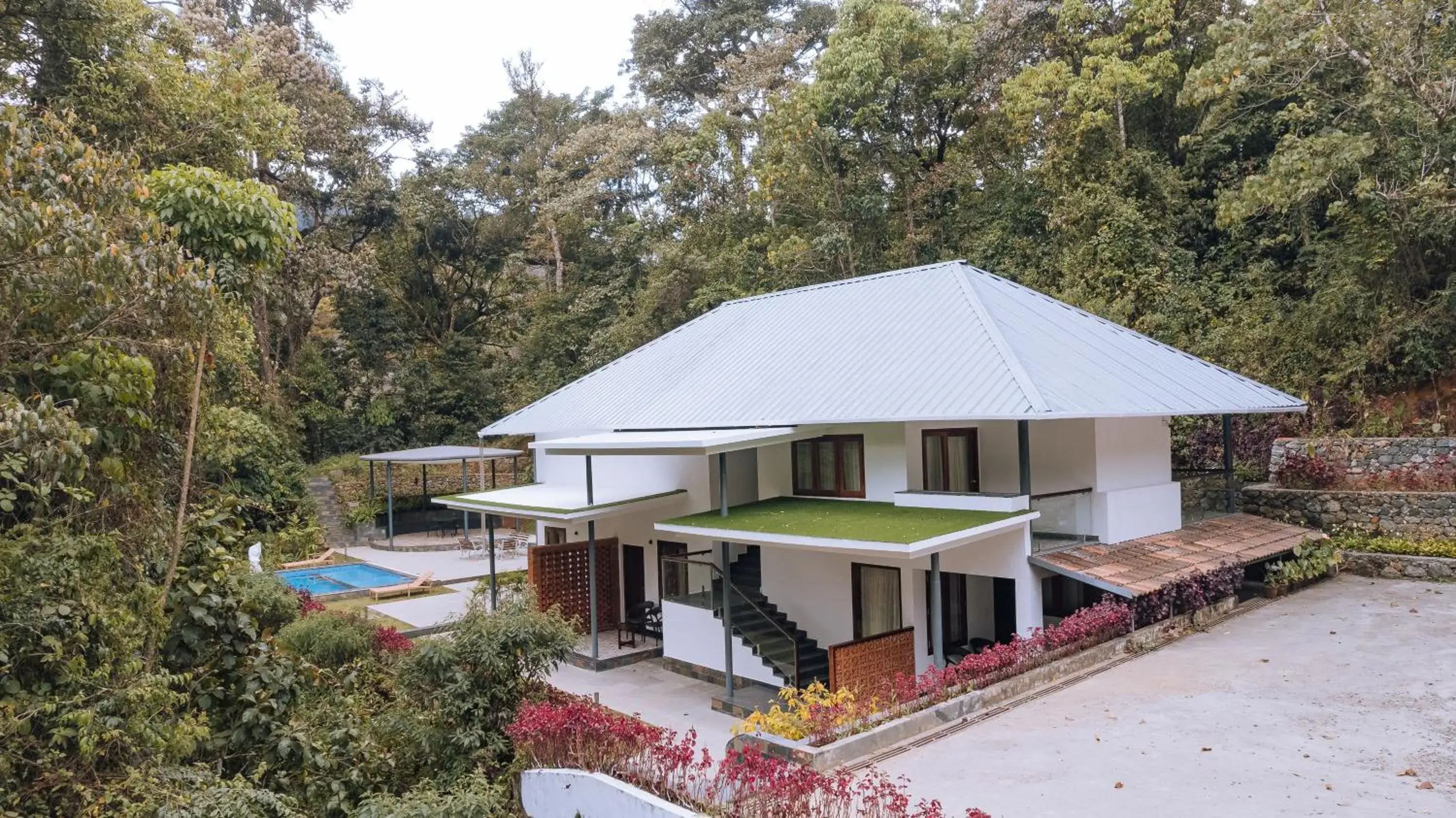 Premium Deluxe room with Common Pool in Elixir Woods Luxury Resort And Spa, Munnar Premium Deluxe room with Common Pool in Elixir Woods Luxury Resort And Spa, Munnar