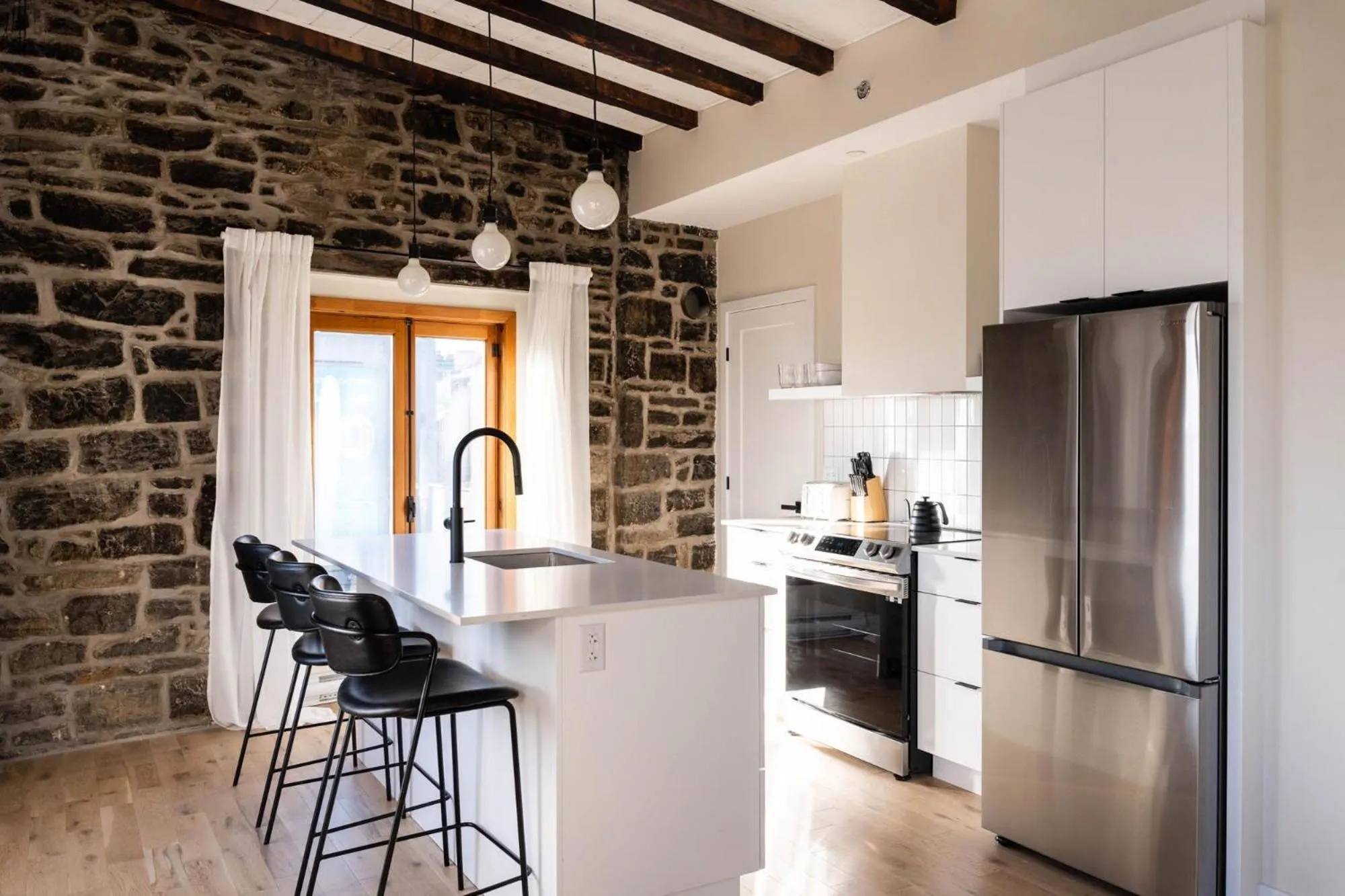 Kitchen or kitchenette in Maison Place Royale by Luxury In Transit