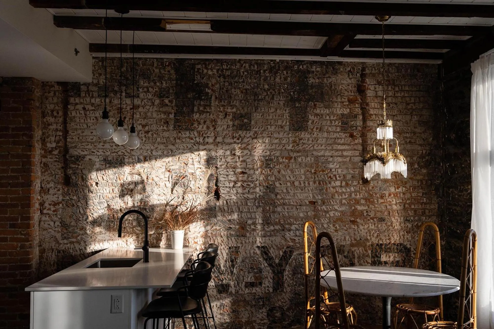 Seating area in Maison Place Royale by Luxury In Transit