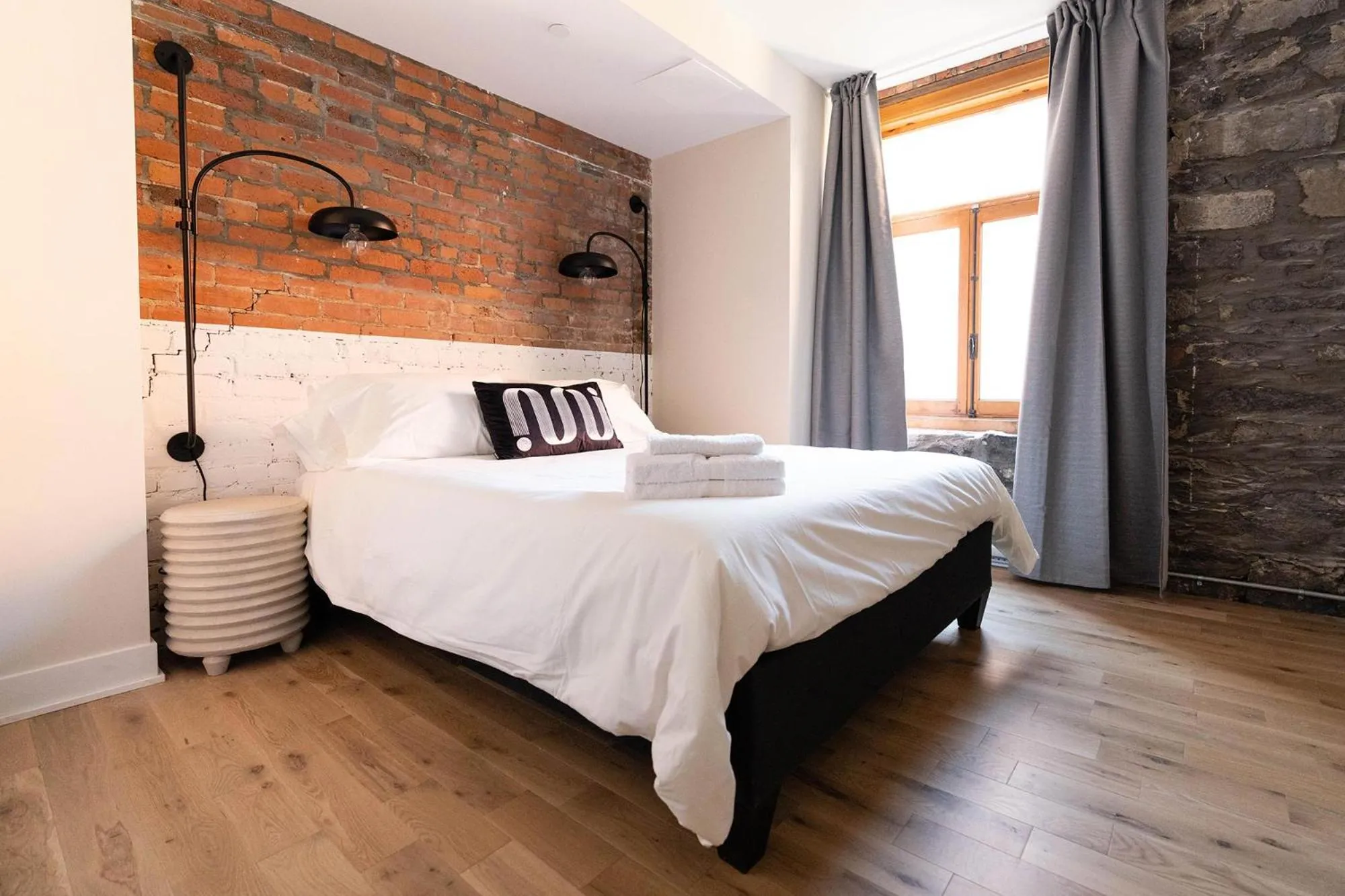 Bed in Maison Place Royale by Luxury In Transit