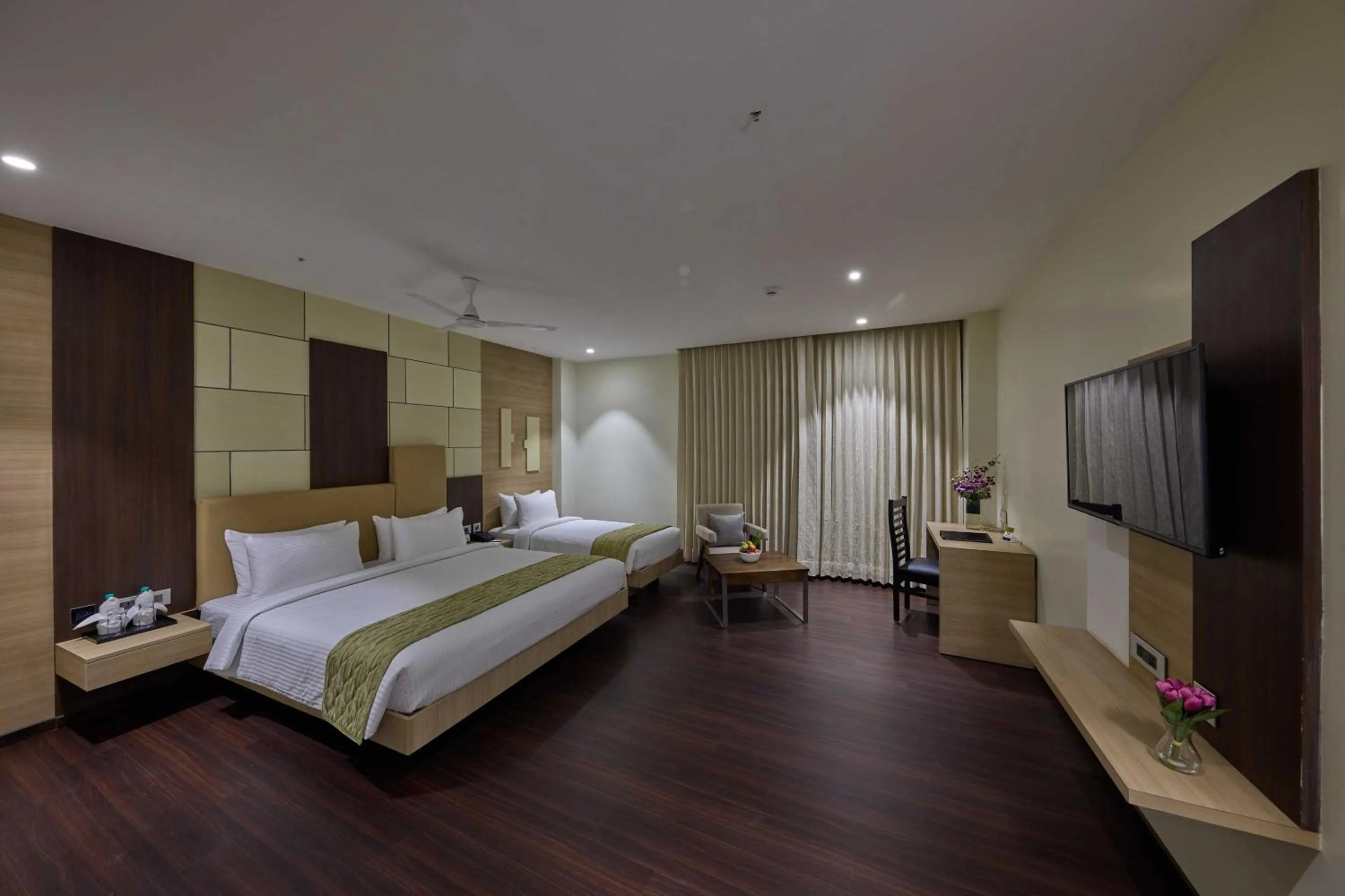 Bed in Grand Continent Hosur A Sarovar Portico Affiliate Hotel