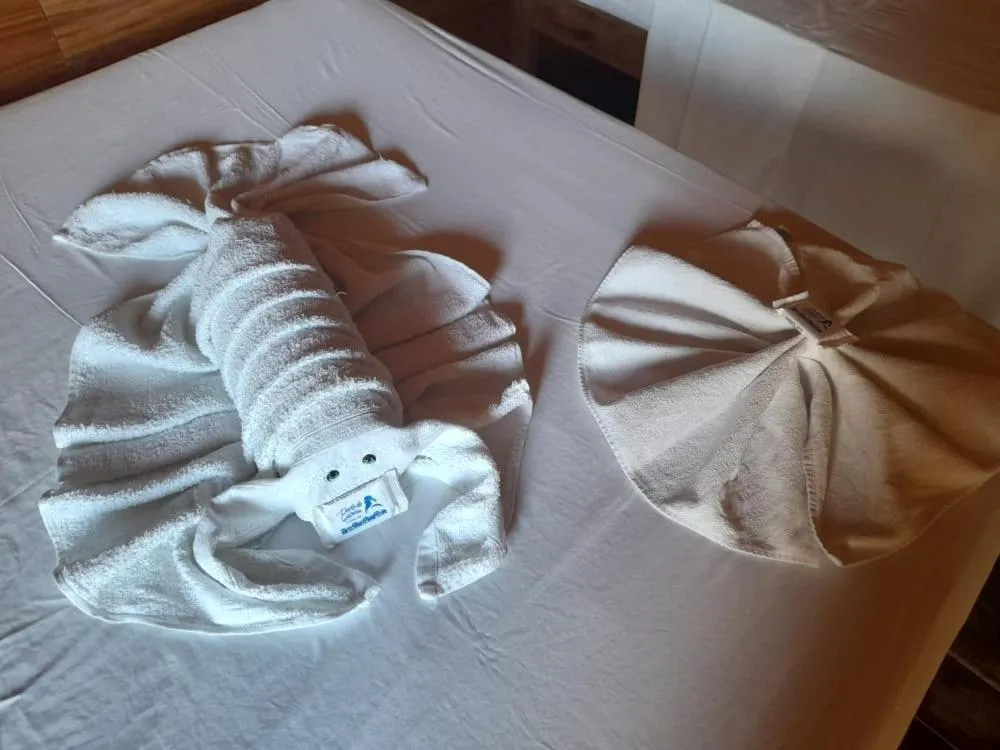 towels, Bed in Pousada Casa de Madeira