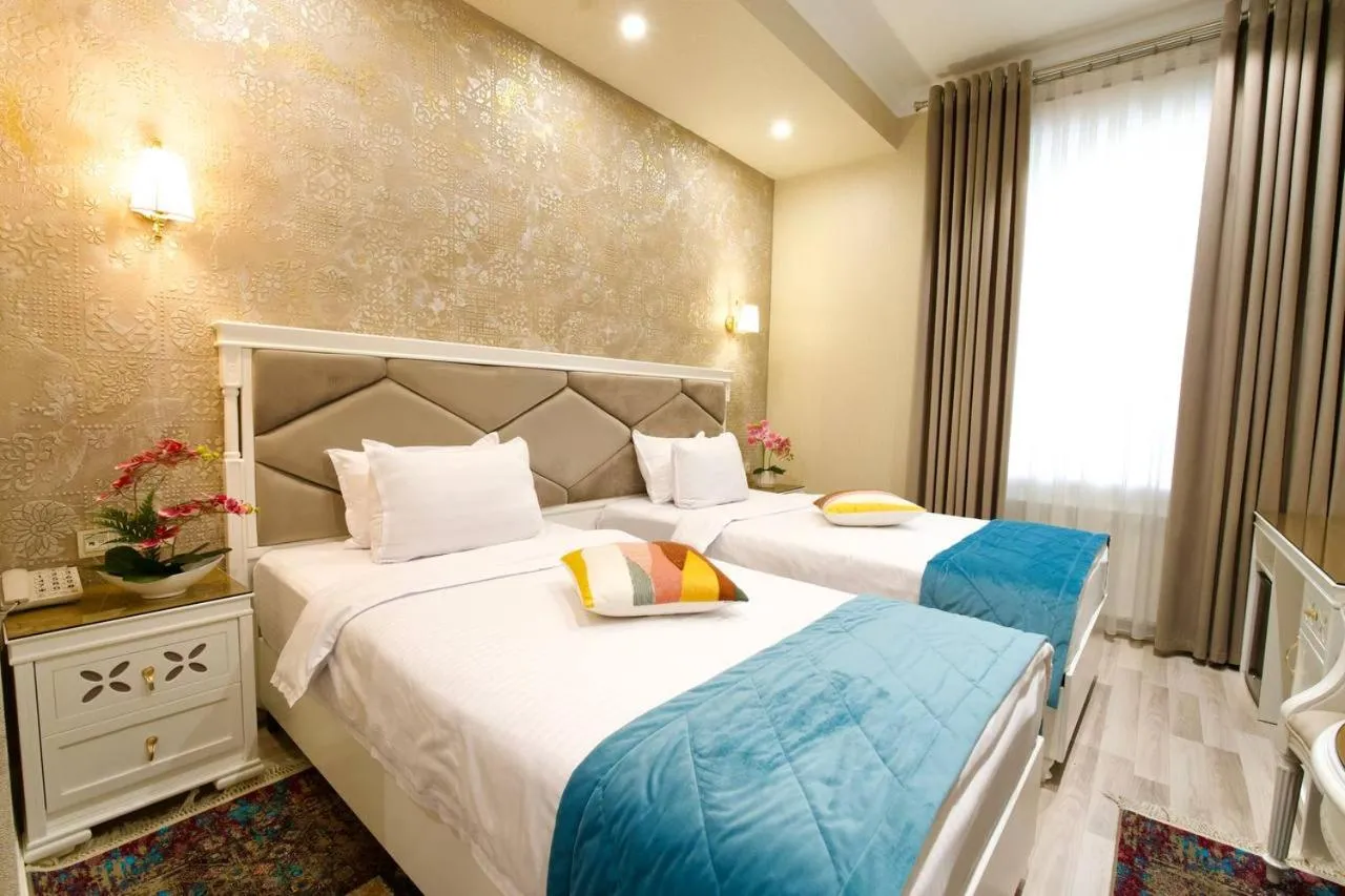 Bed in HOTEL SILK ROAD EMPIRE SAMARKAND