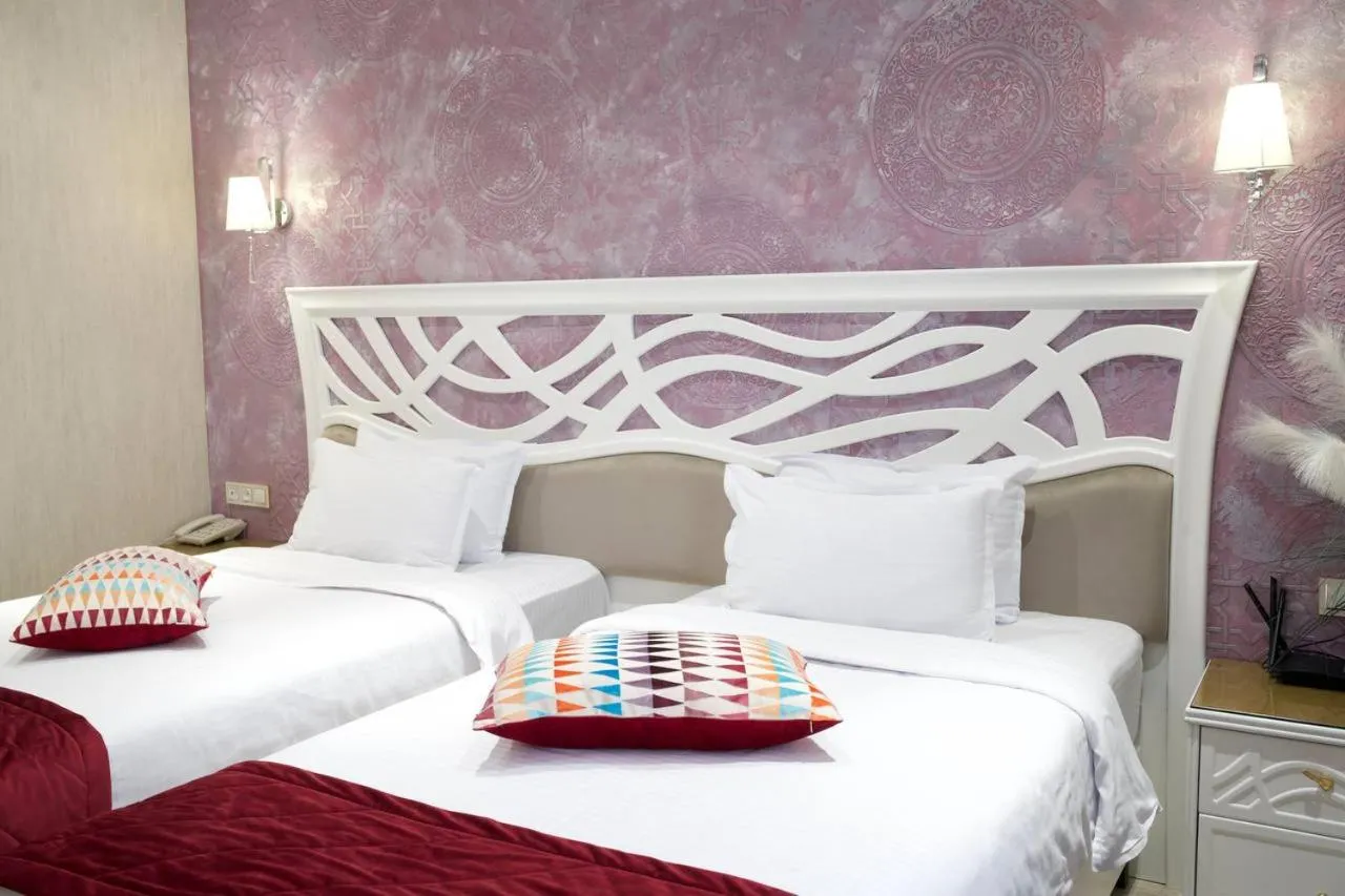 Bed in HOTEL SILK ROAD EMPIRE SAMARKAND