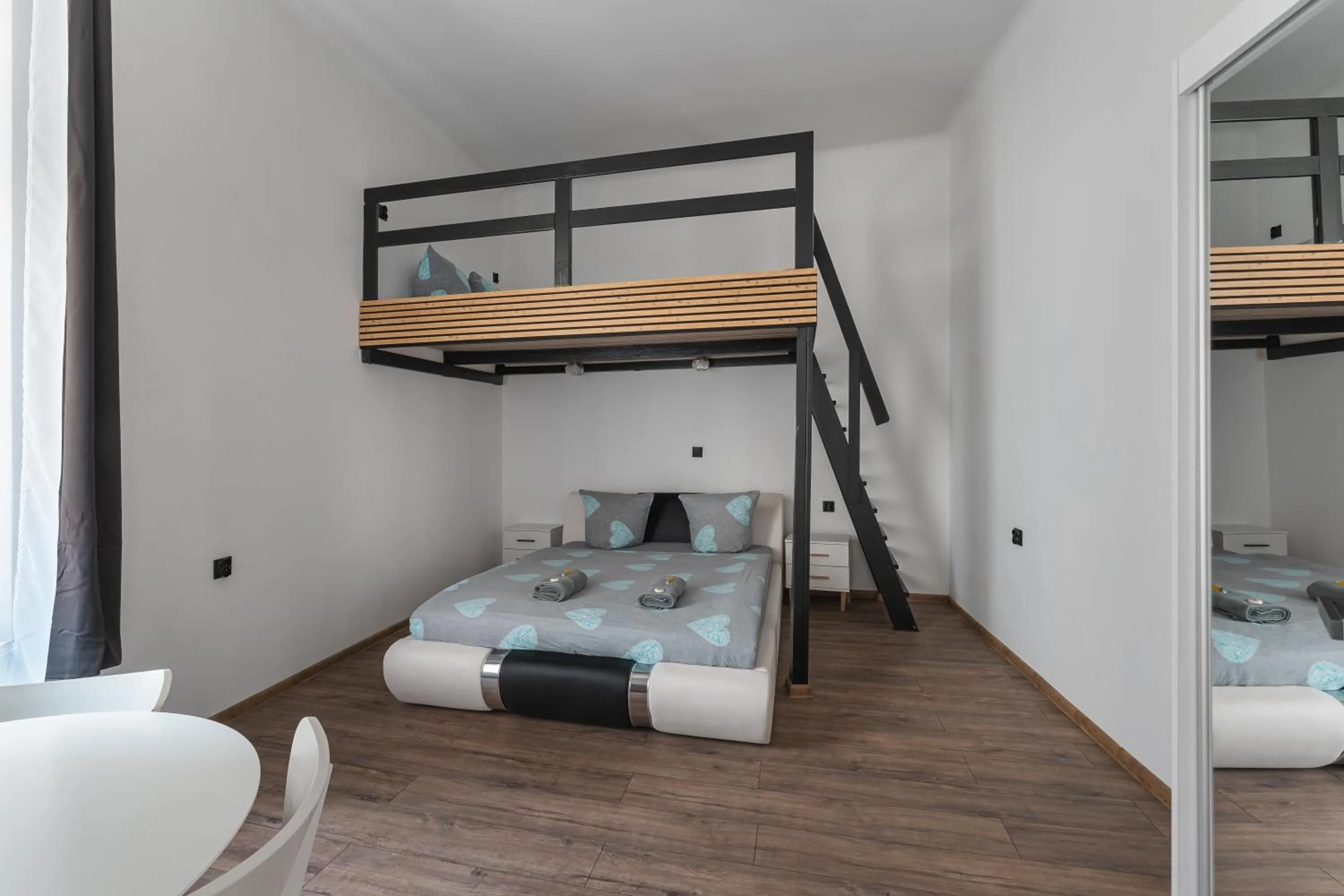 Bed in Queen Apartments