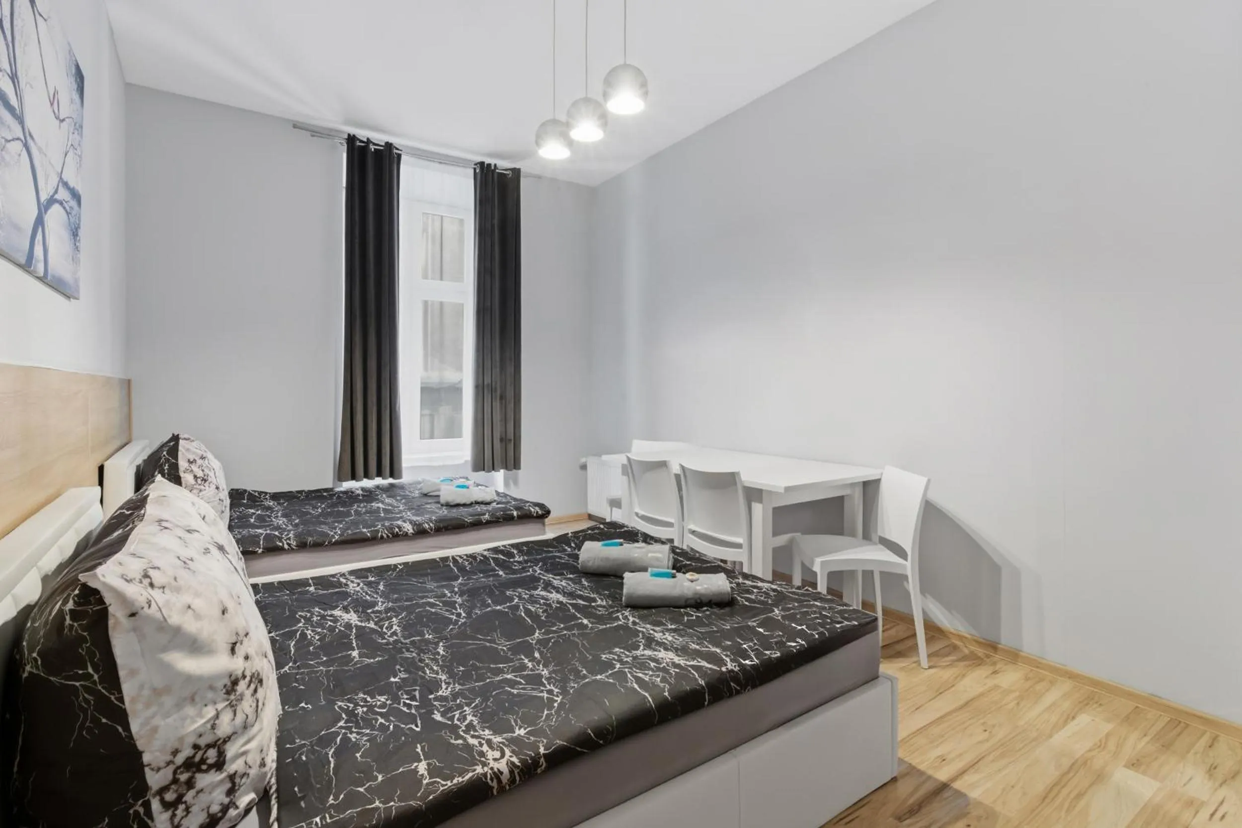 Bed in Queen Apartments