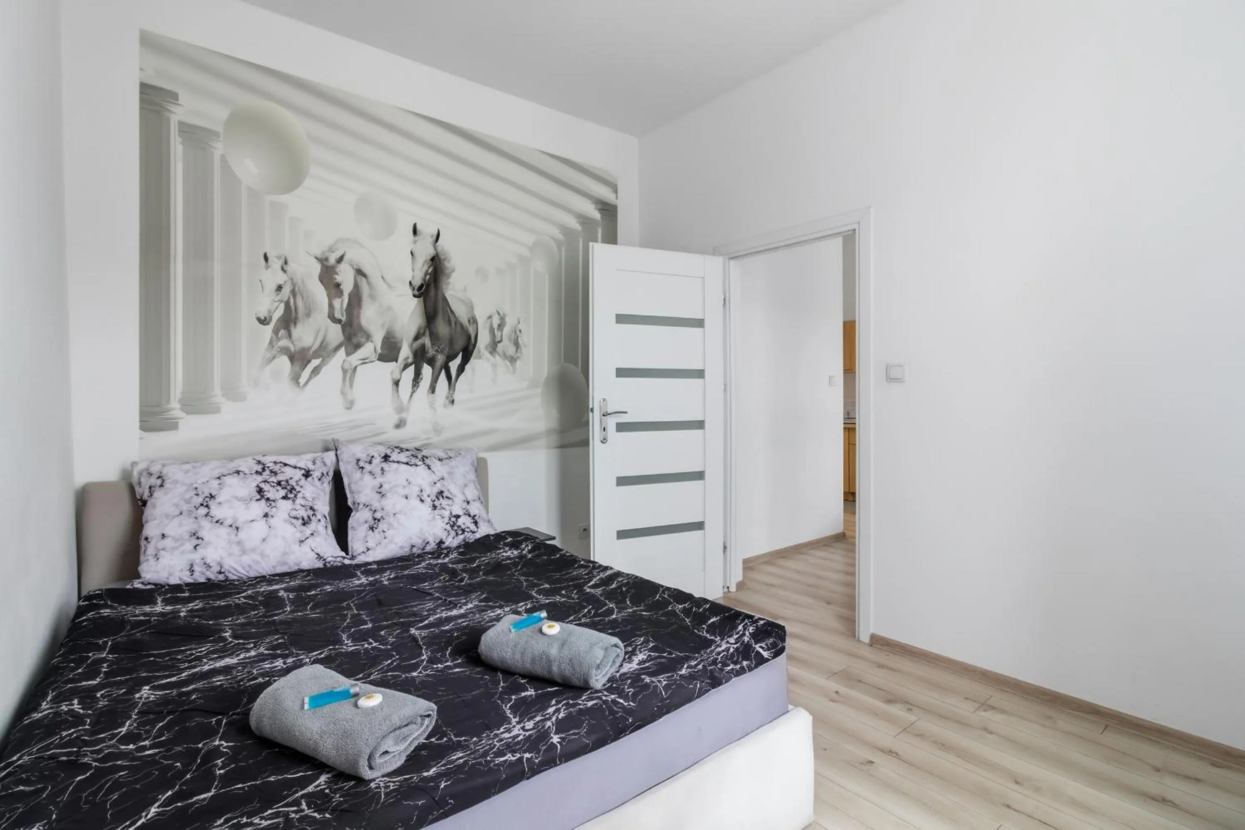 Bed in Queen Apartments