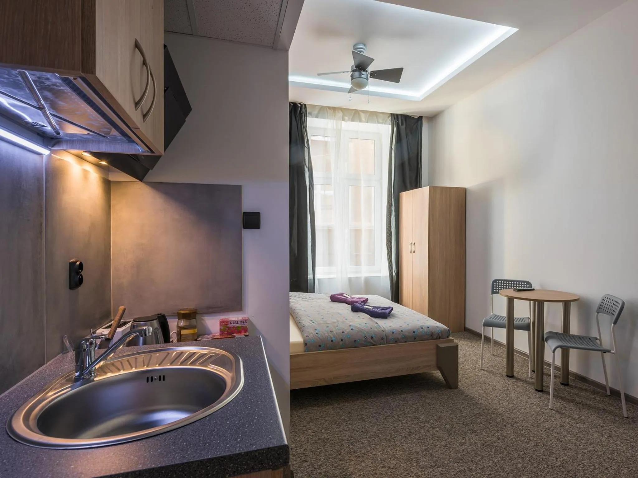 Bed in Queen Apartments