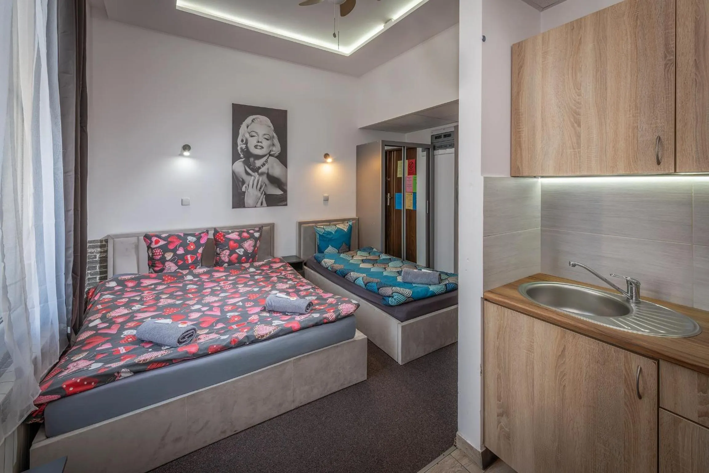 Bed in Queen Apartments