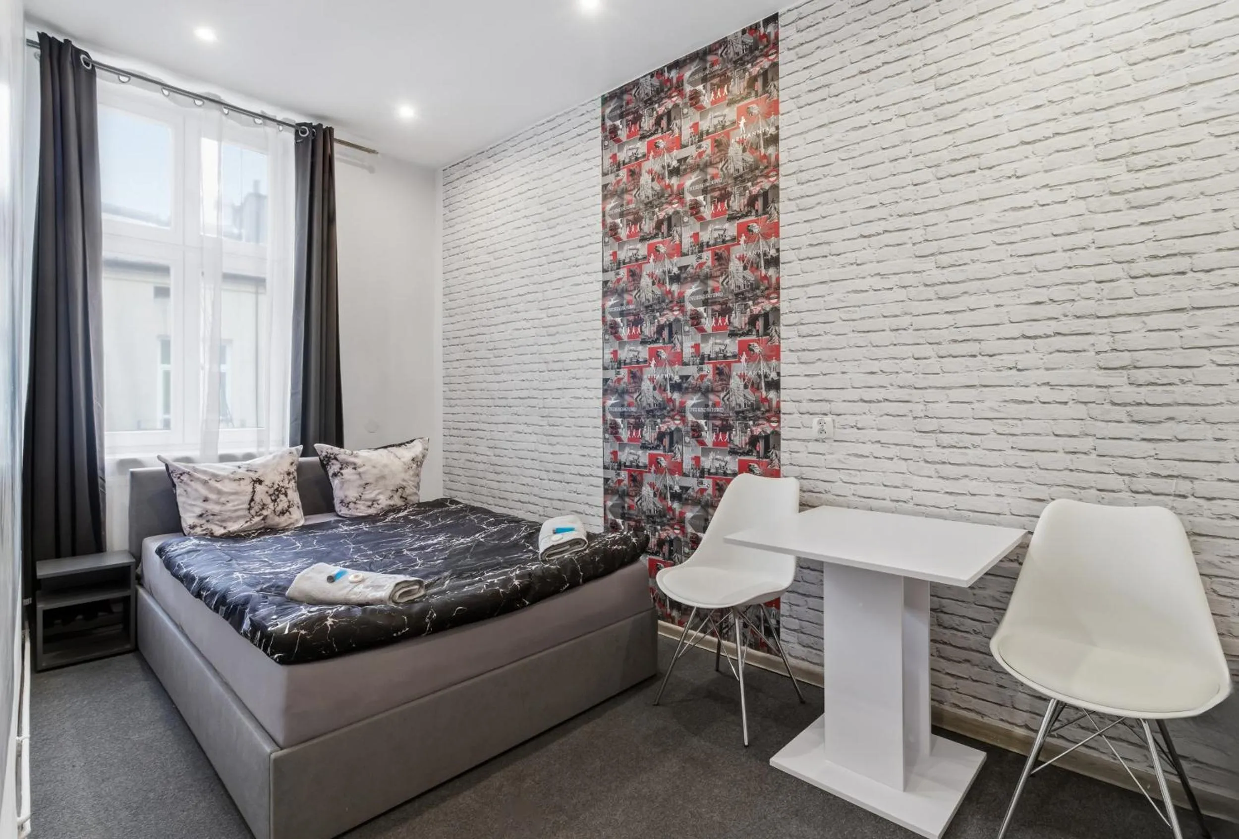 Bed in Queen Apartments