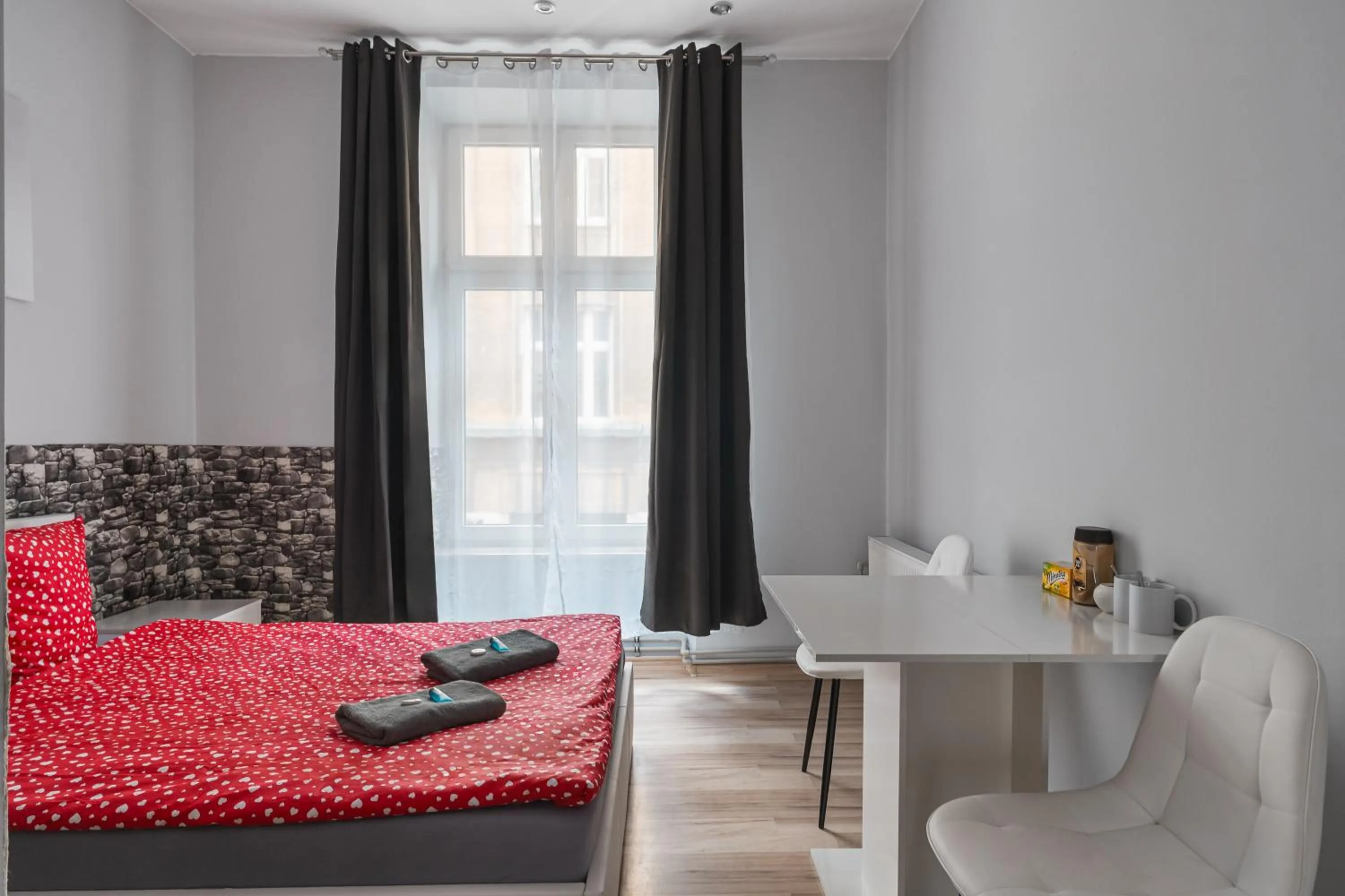 Bed in Queen Apartments