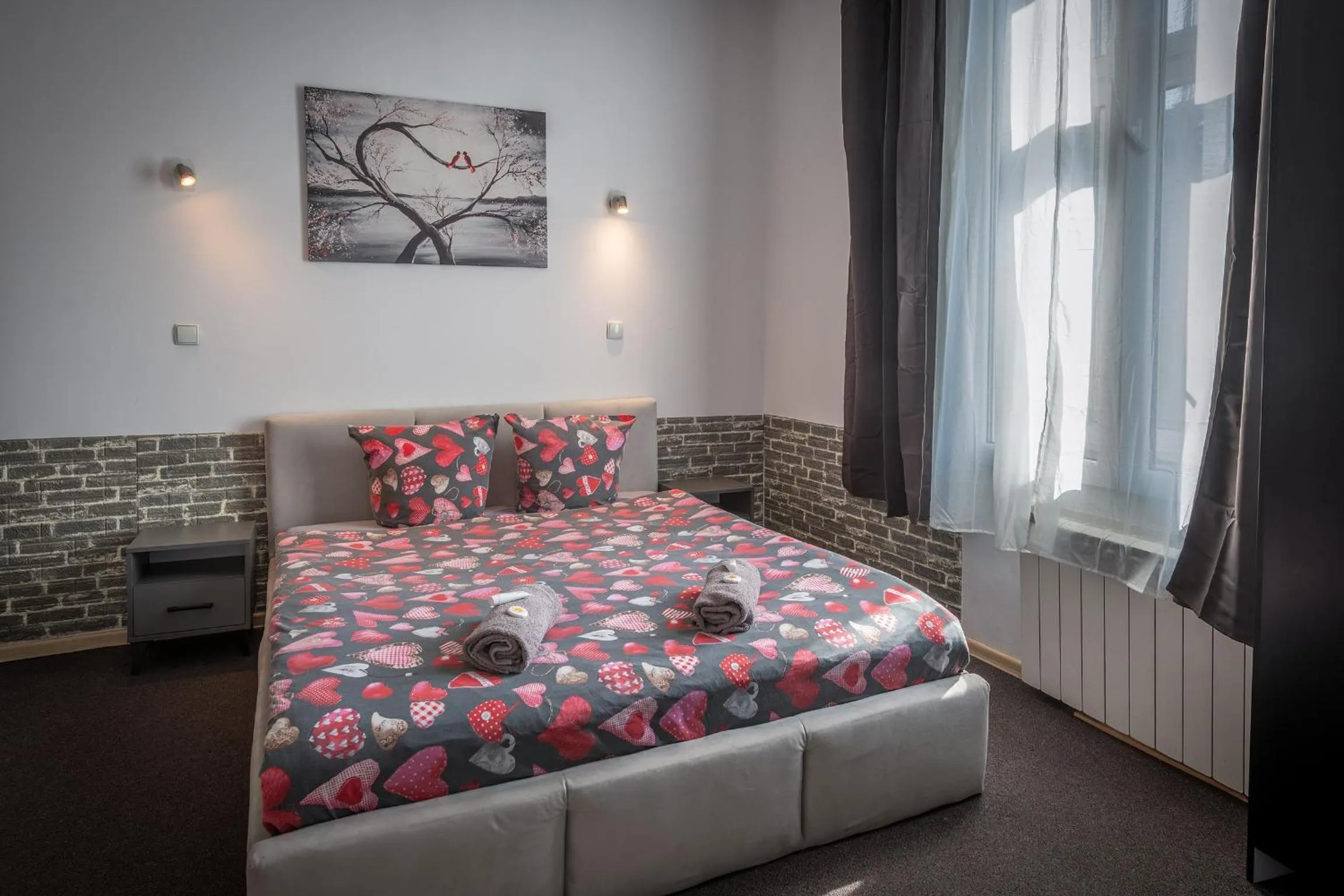 Bed in Queen Apartments