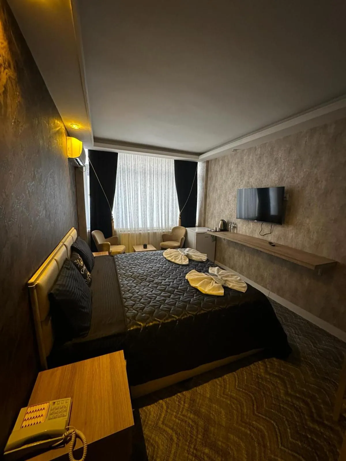 Communal lounge/ TV room, Bed in ÇANKAYA SUIT HOTEL