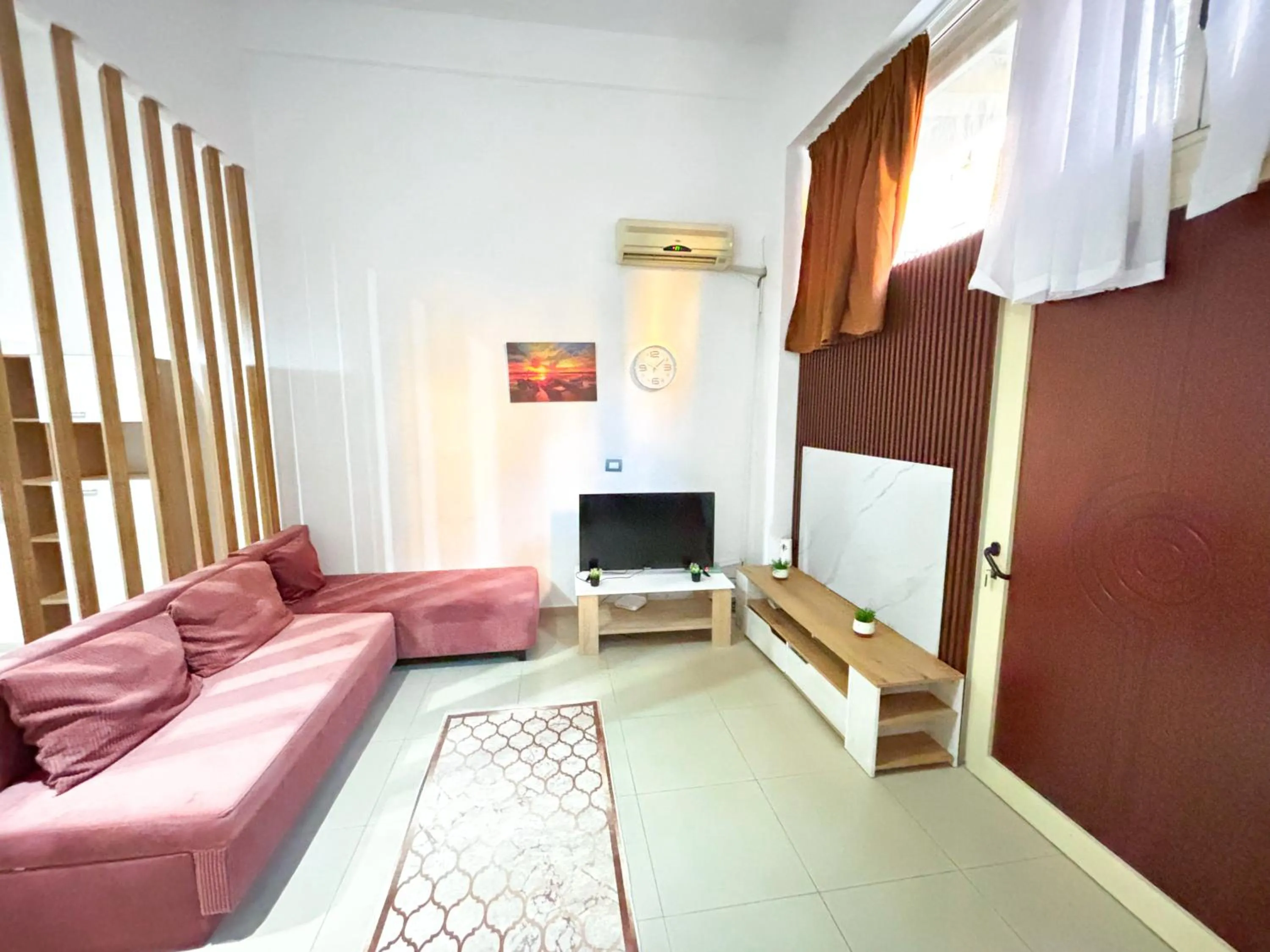 Living room, Bed in Budget Retreat Tirana & Studios