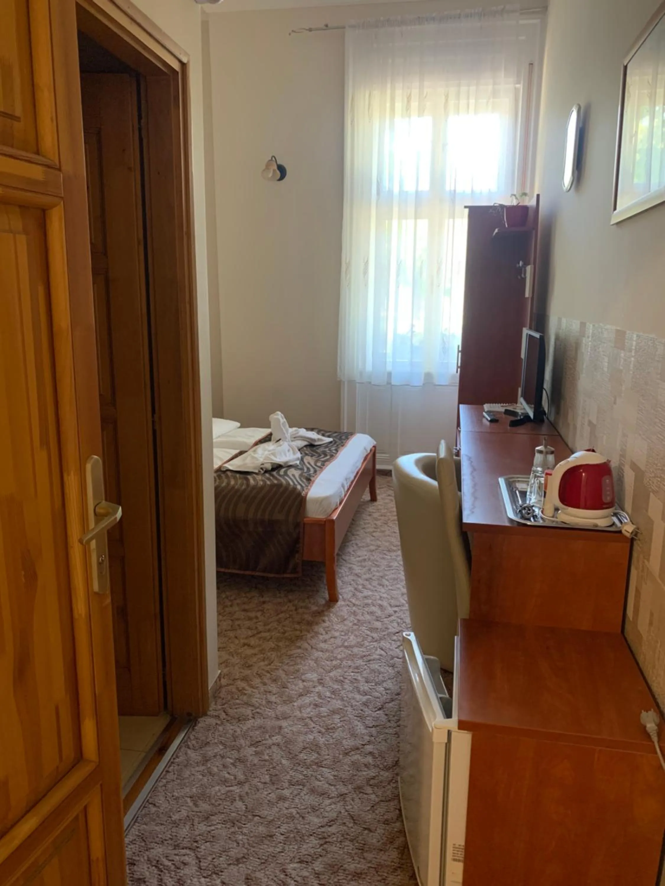 Bed in Szent István Wellness Panzió