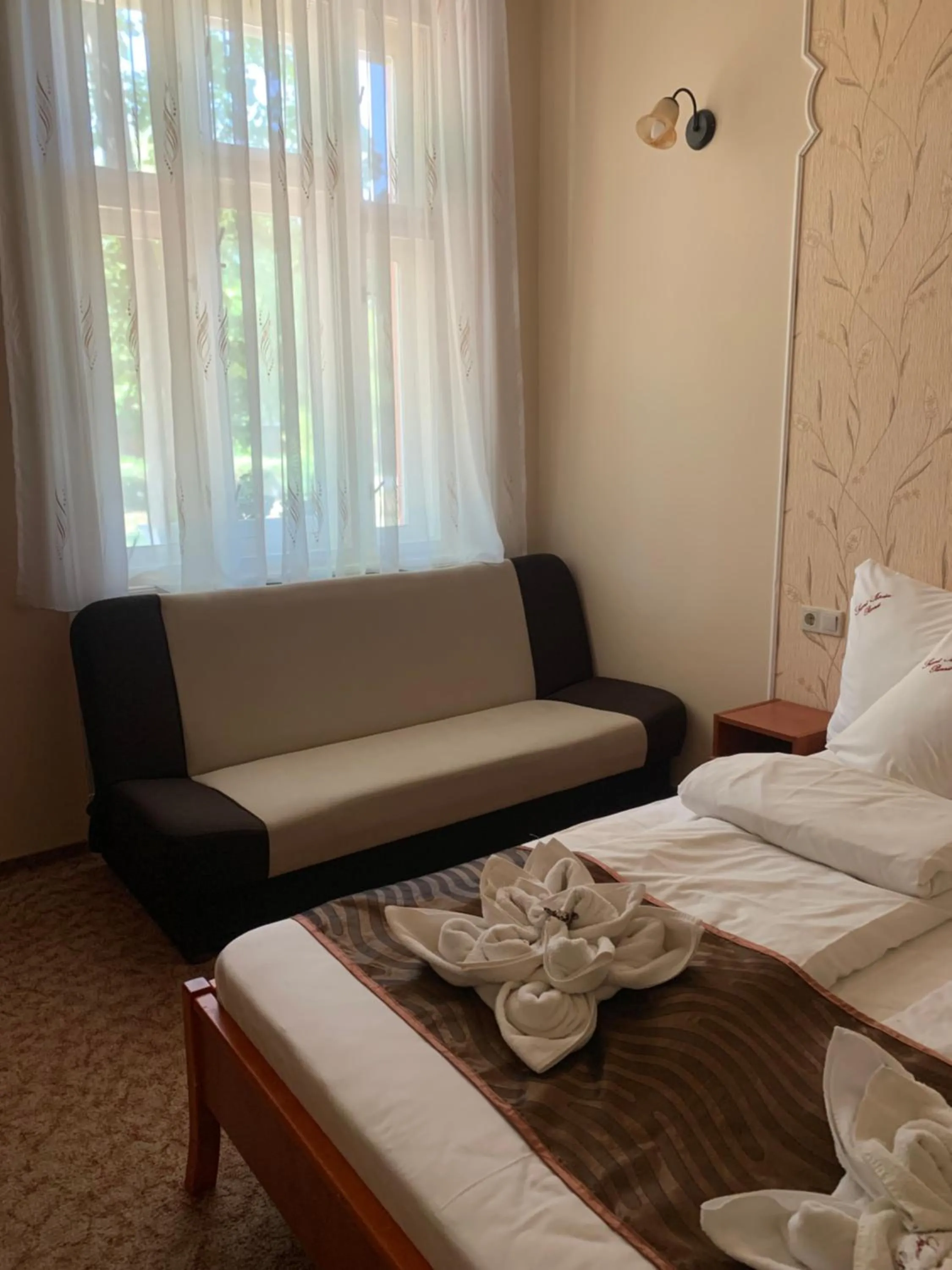 Bed in Szent István Wellness Panzió