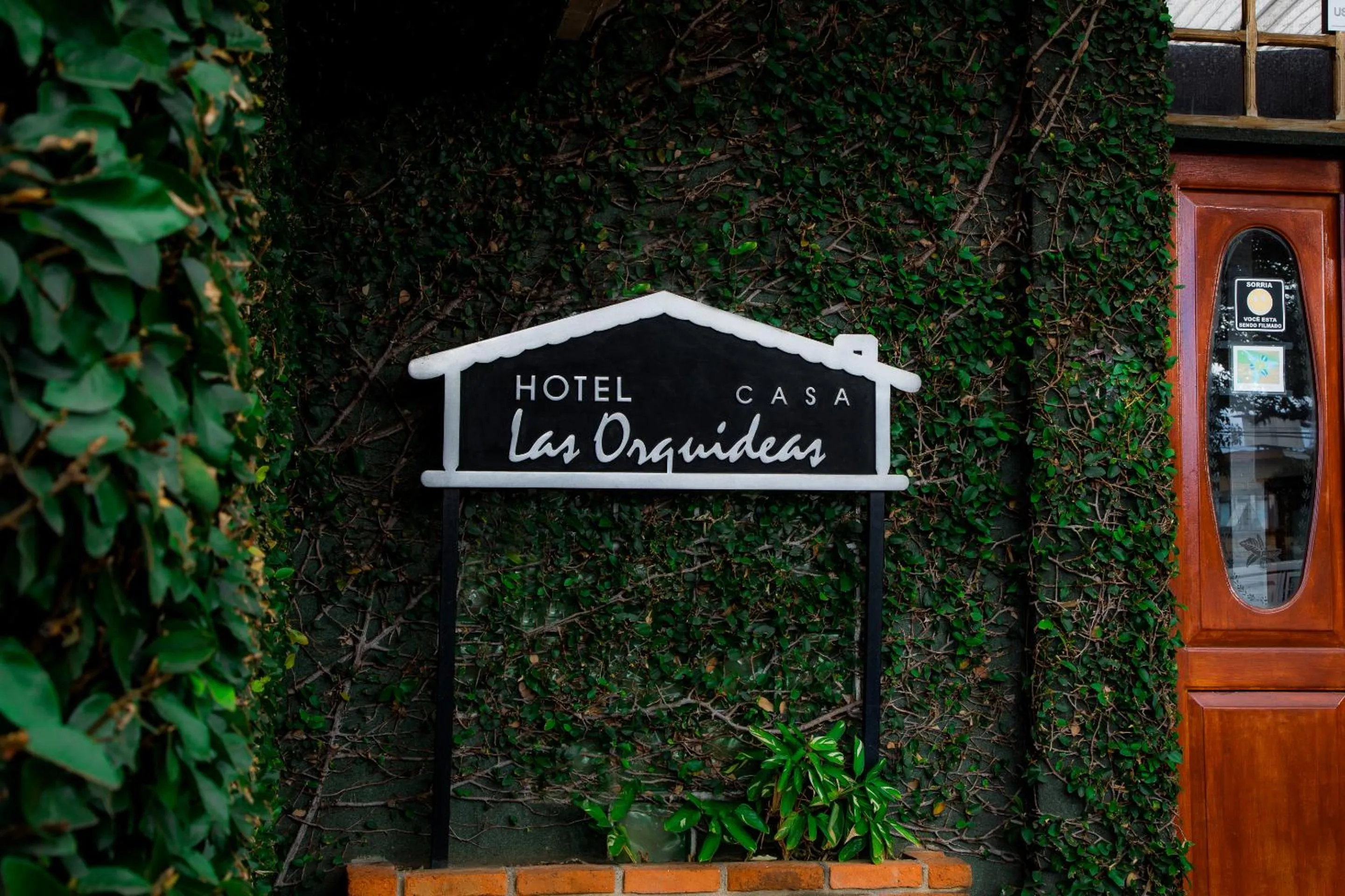 Property logo or sign in Boutique Hotel Casa Orquídeas