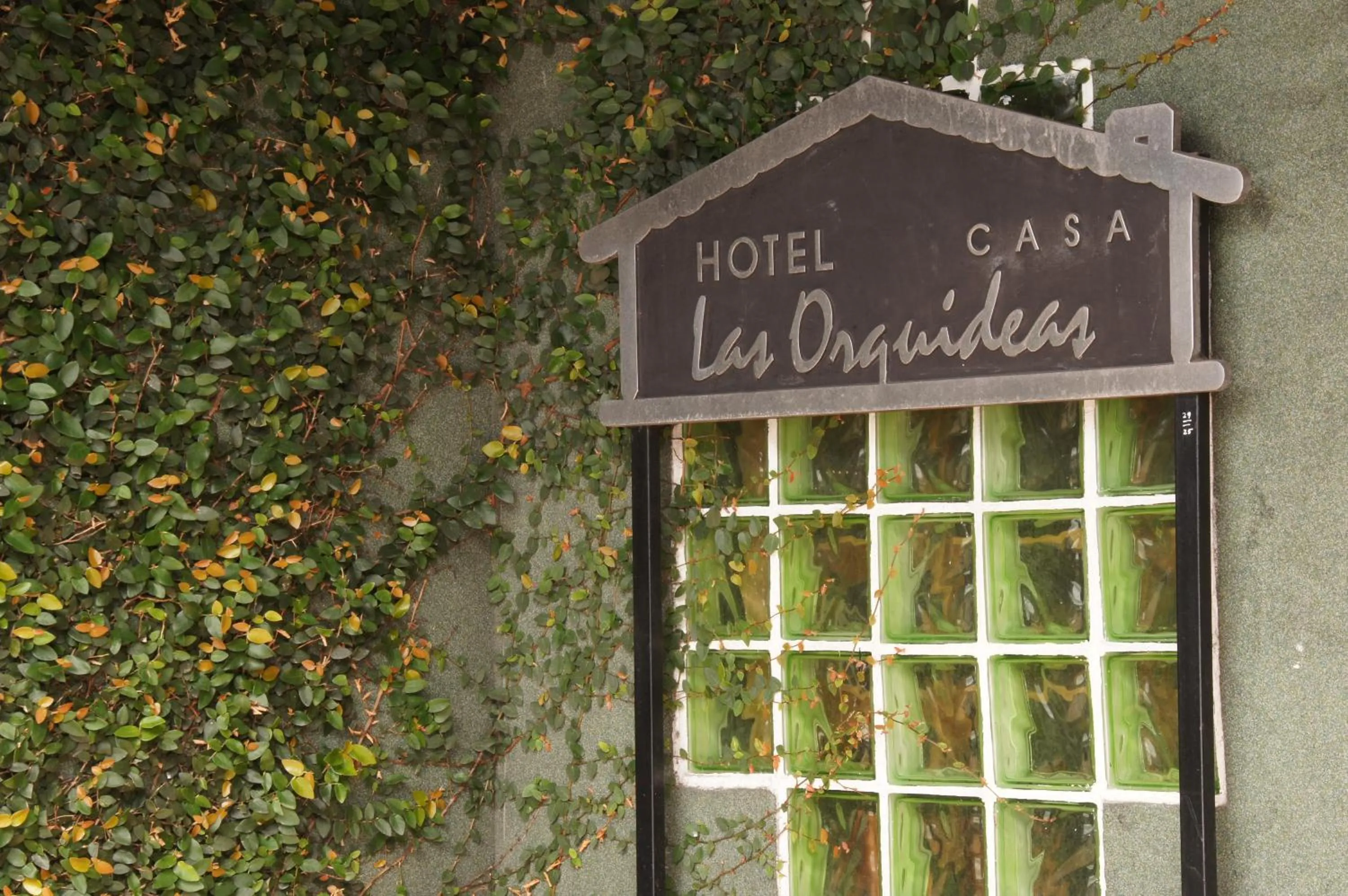 Property logo or sign in Boutique Hotel Casa Orquídeas