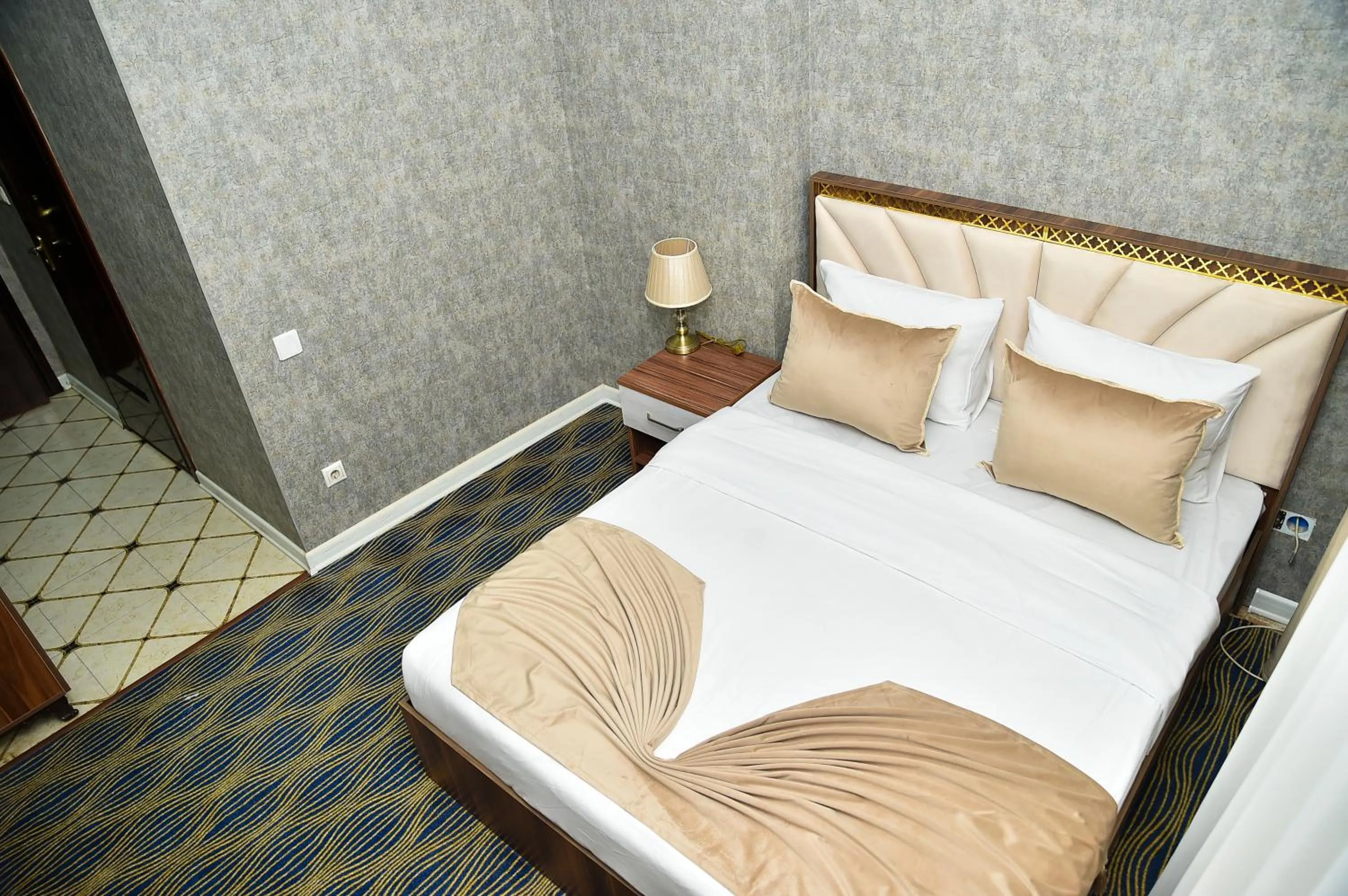 Bed in Boulevard Rigs Boutique Hotel