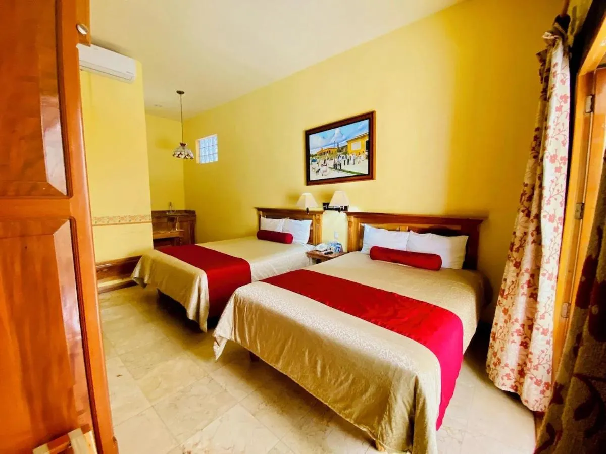 Bed in Cancun International Suites